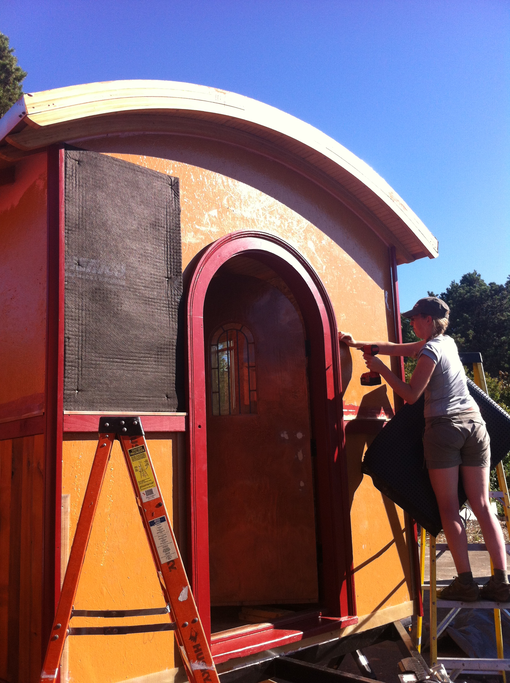 Laura-Installing-Rain-Screen-Around-Door.jpg