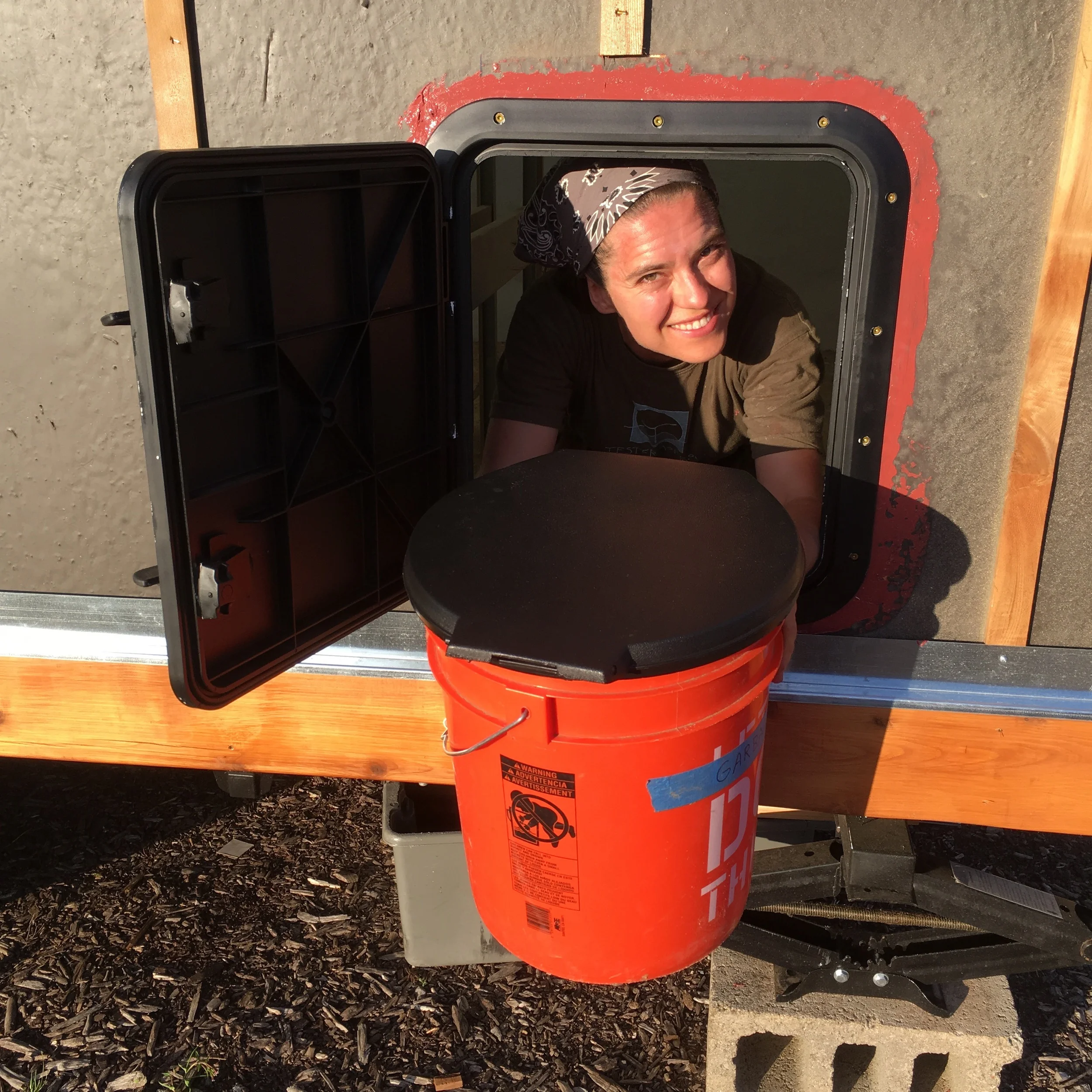 Lina Tests Access Hatch with Loo Bucket