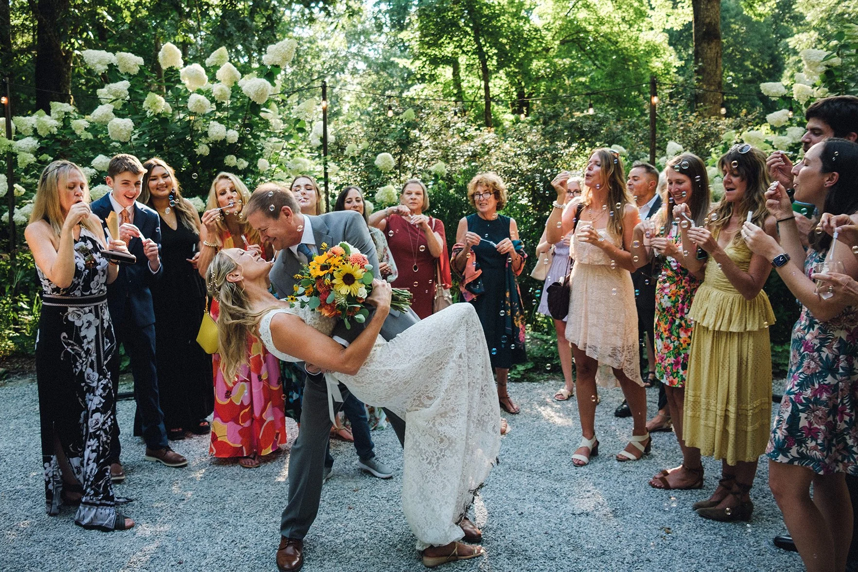 Outdoor wedding reception in a wooded garden setting captured by Appalachian Blue Ridge photographer