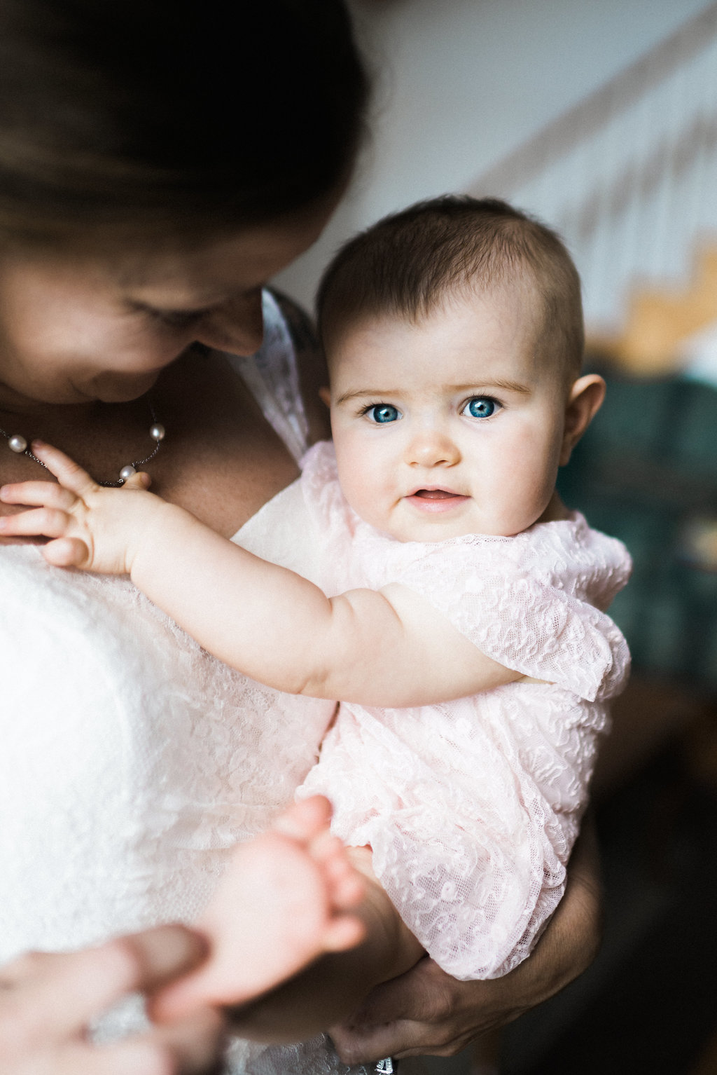 bride looks at baby