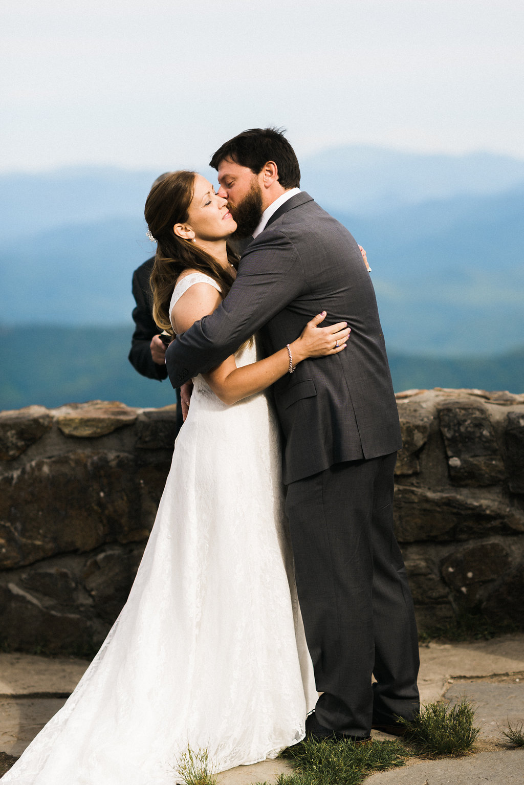 groom hugs bride