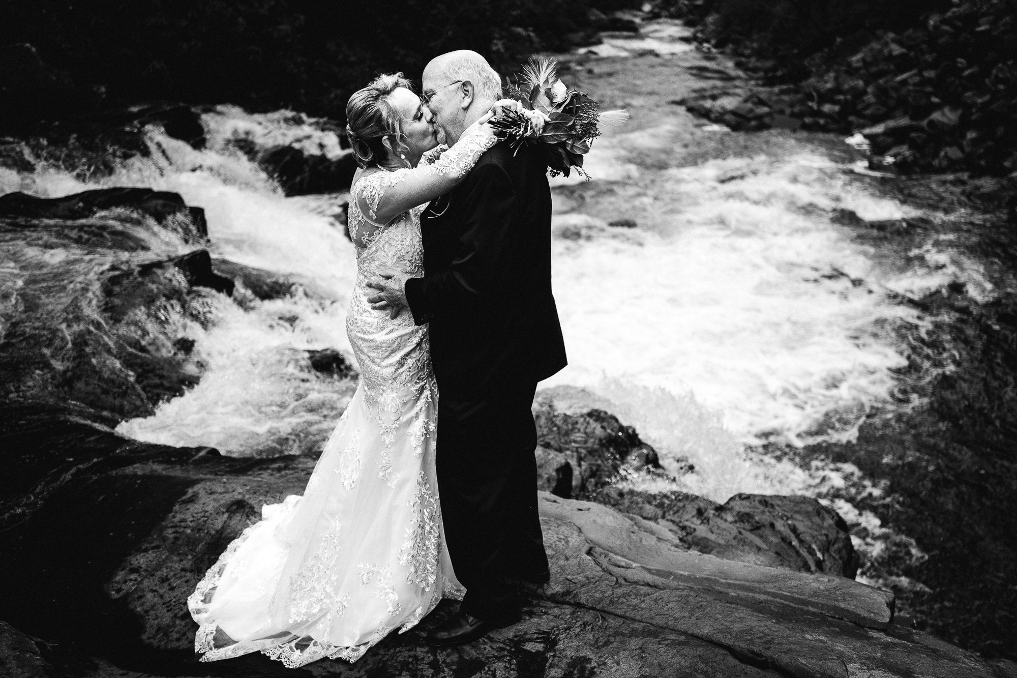 Documentary black and white waterfall wedding