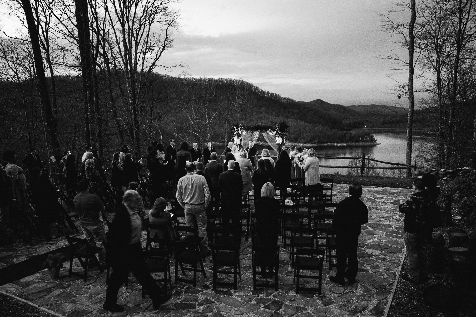 Ceremony at night at Nantahala Weddings in black and white