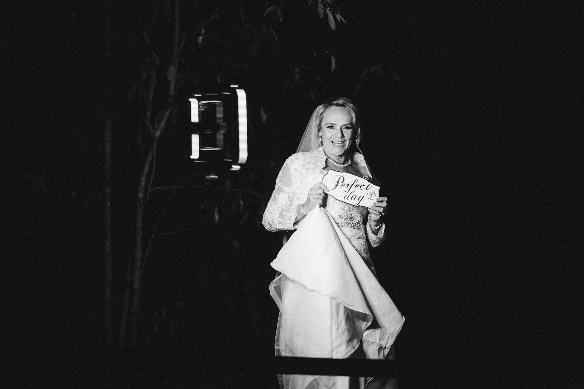 Bride taking picture at her reception