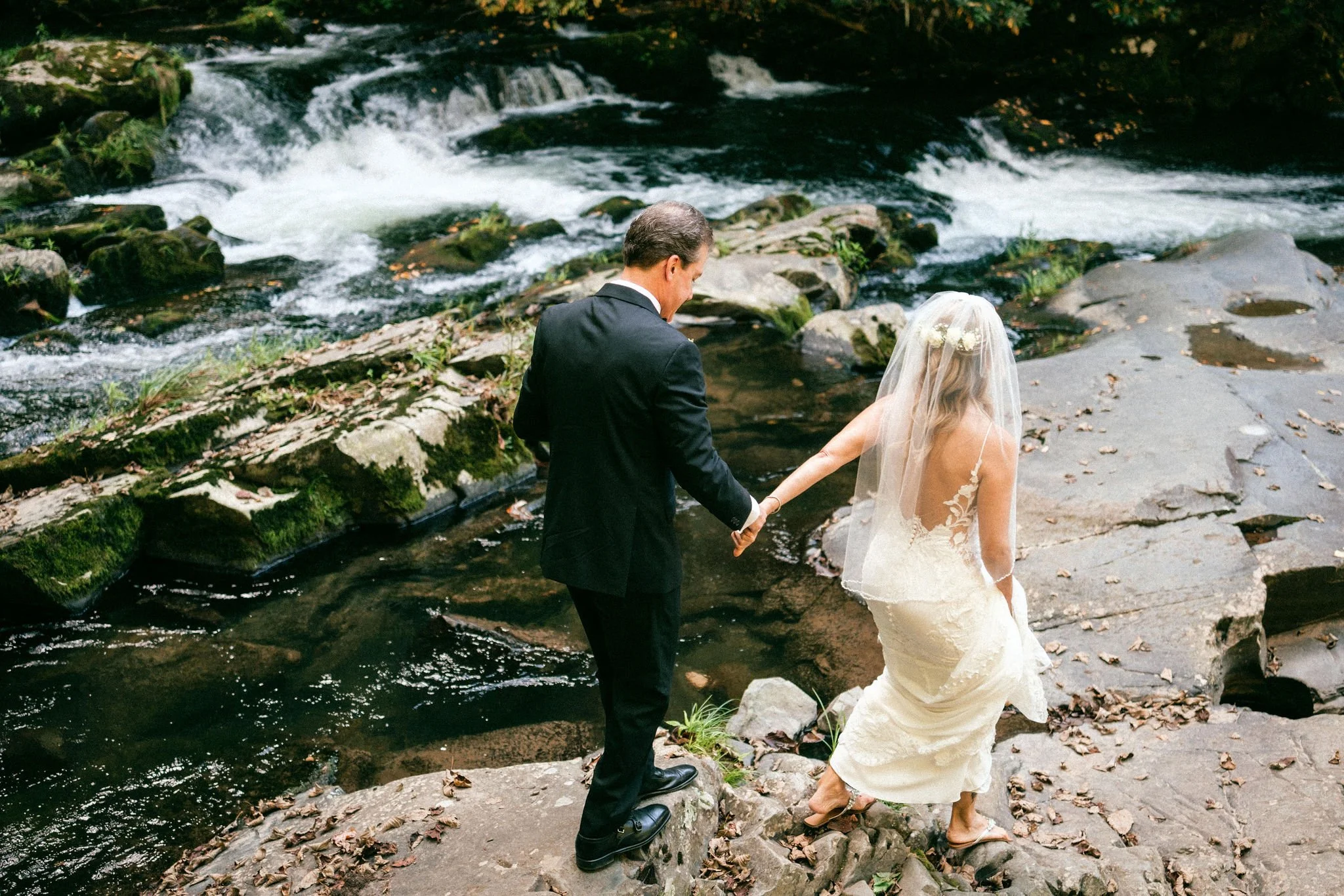 Newlyweds walking together after exchanging vows, reflecting quiet joy and intentional wedding vibes in the mountains of North Carolina..jpg