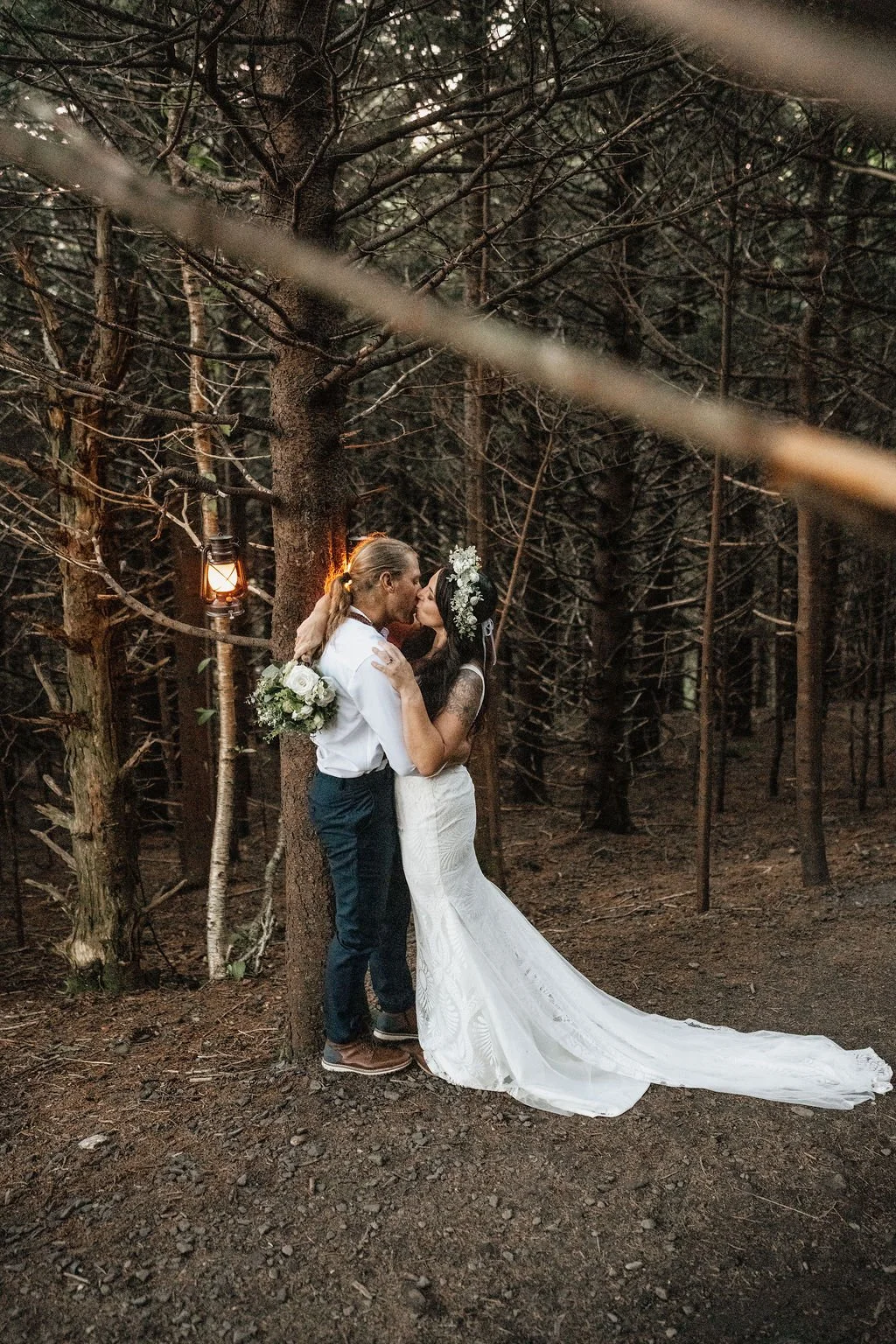 Small elopement ceremony under a pine tree arch..jpg