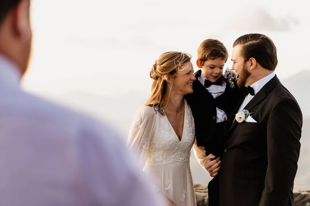 Victoria, Quinn, and their family gathered at Wayah Bald stone fire tower with four-state Appalachian mountain views during their intimate sunrise elopement, Nantahala NC