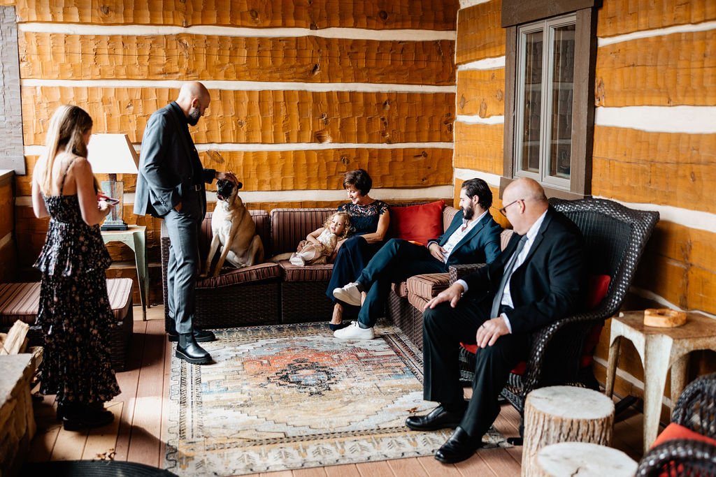 Wedding guests gathering together for an intimate cabin celebration at a Blue Ridge Georgia mountain wedding, photographed by Appalachian Wedding Photography