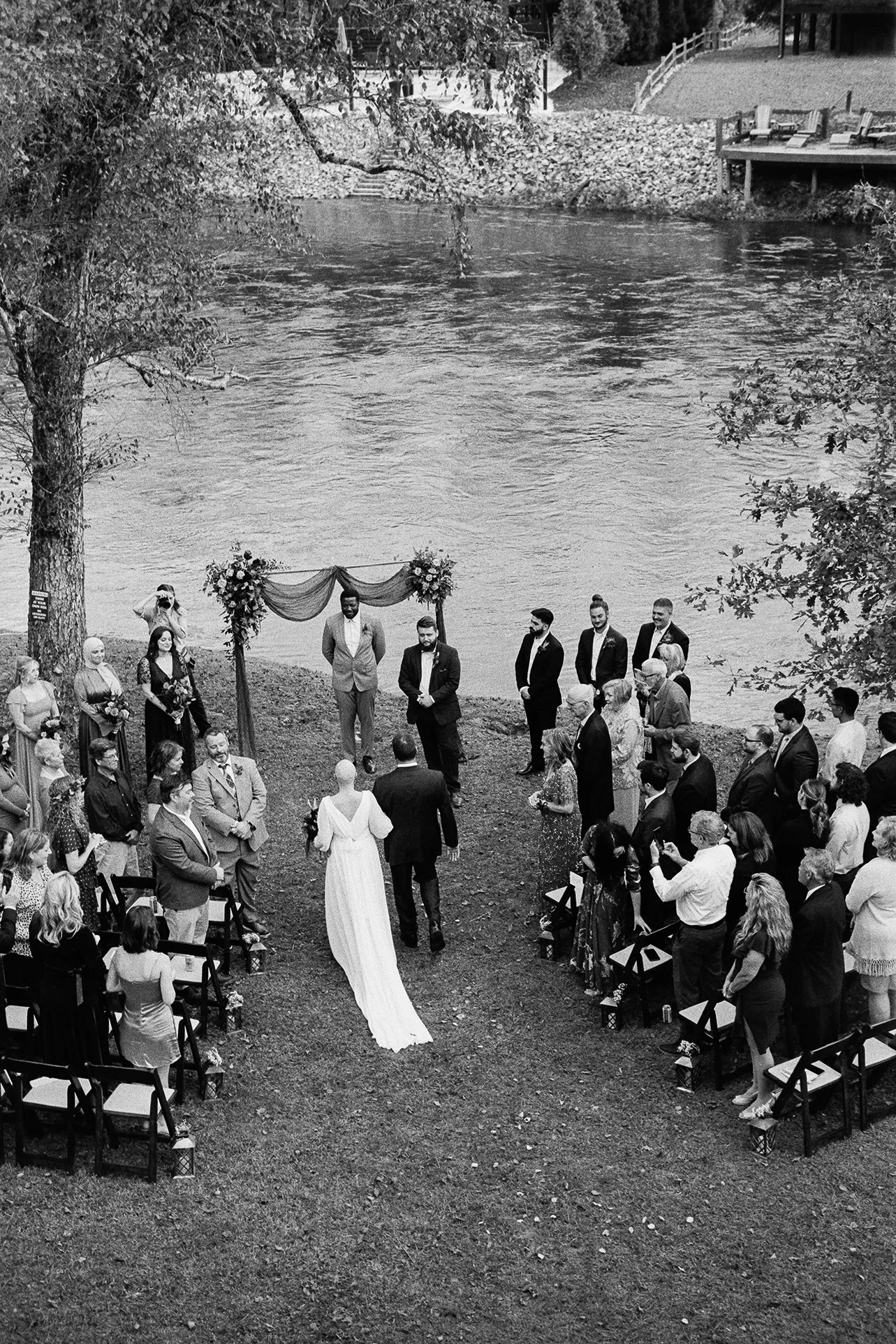 Black and white aerial view of an outdoor wedding ceremony aisle in the Appalachian mountains