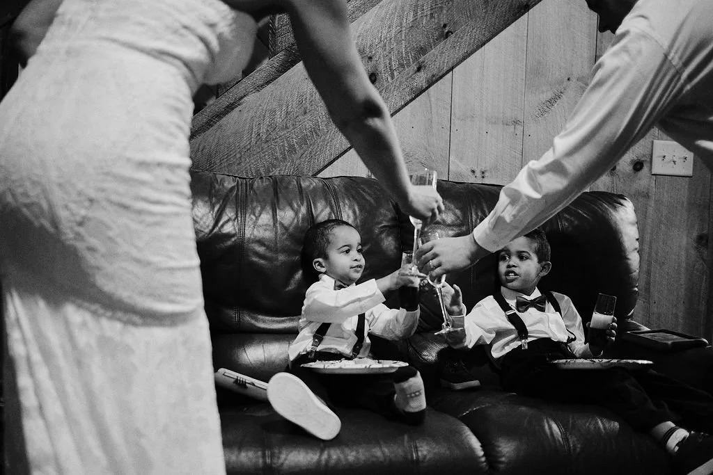 Black and white candid family moment at an intimate wedding reception, Blue Ridge GA intimate wedding photographer Appalachian Wedding Photography