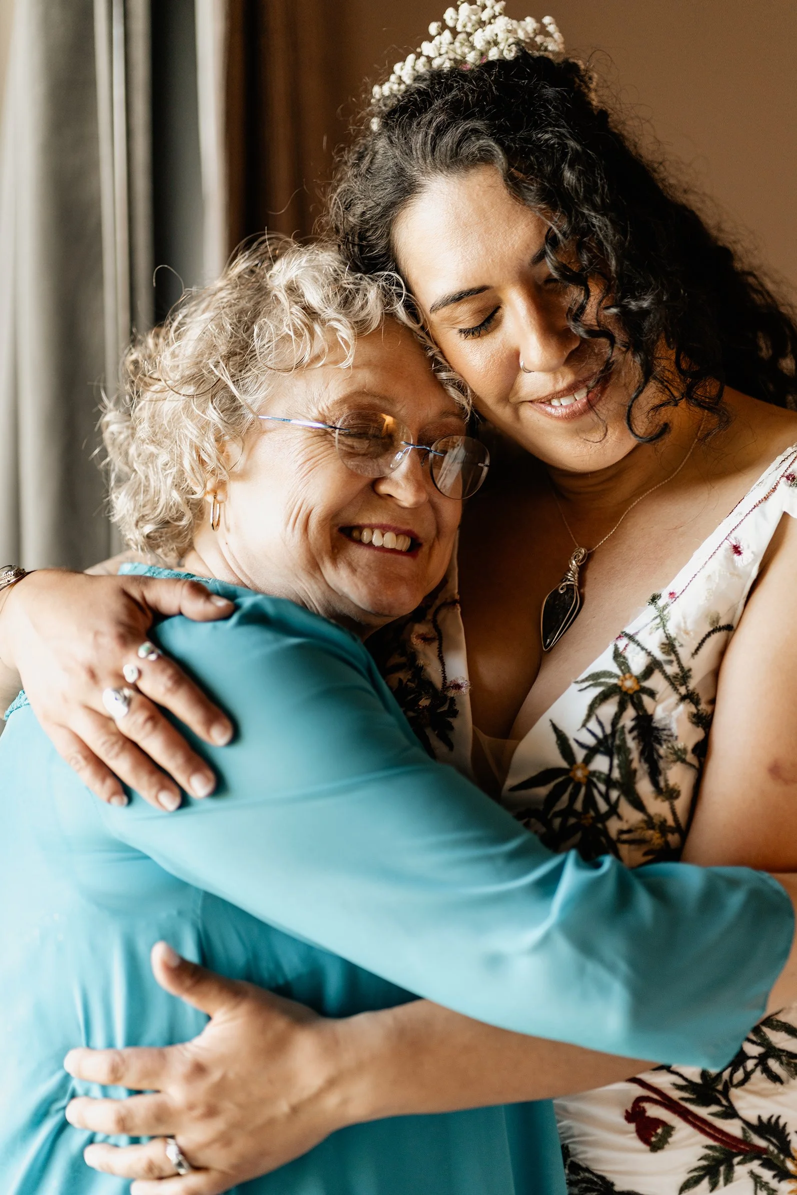 Rob and Myranda sharing an emotional hug with family during their Blue Ridge wedding
