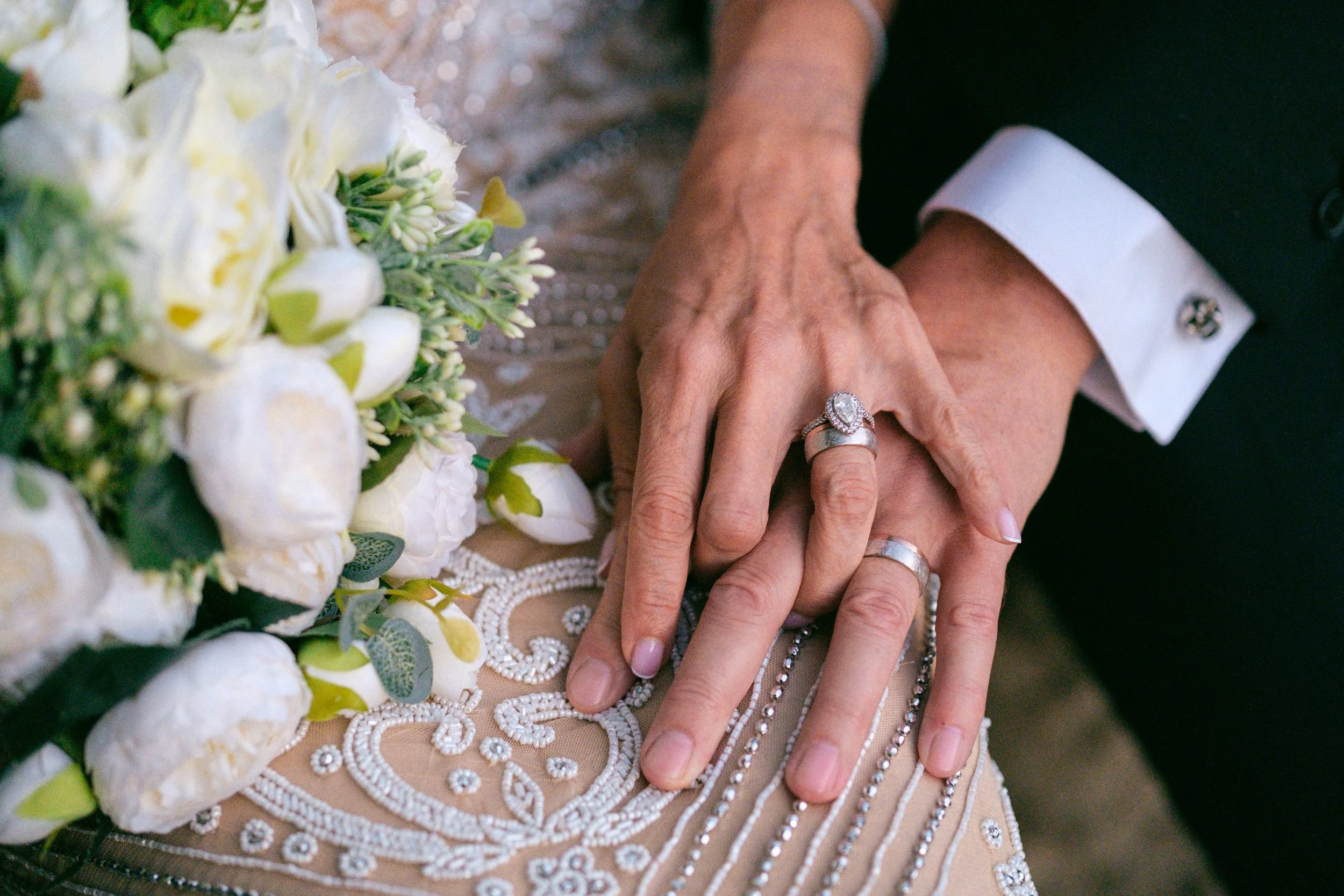 Holding Hands Portrait with wedding rings on their finger by Appalachian Wedding Photography