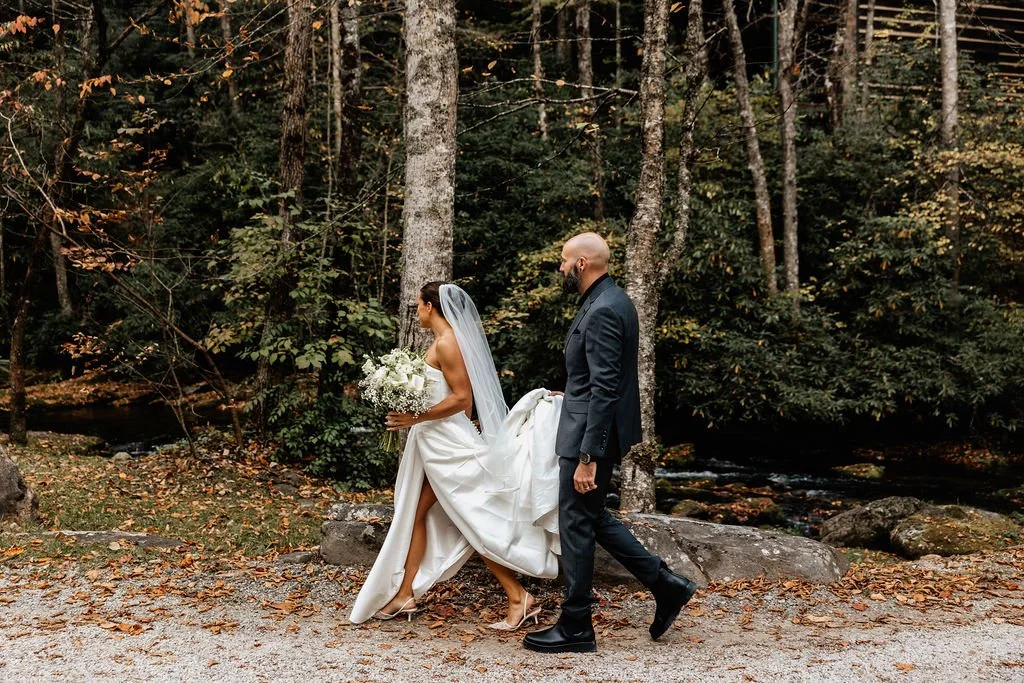 Jason and Cayli walking together through the Blue Ridge Georgia mountain landscape during their intimate cabin wedding, Appalachian Wedding Photography
