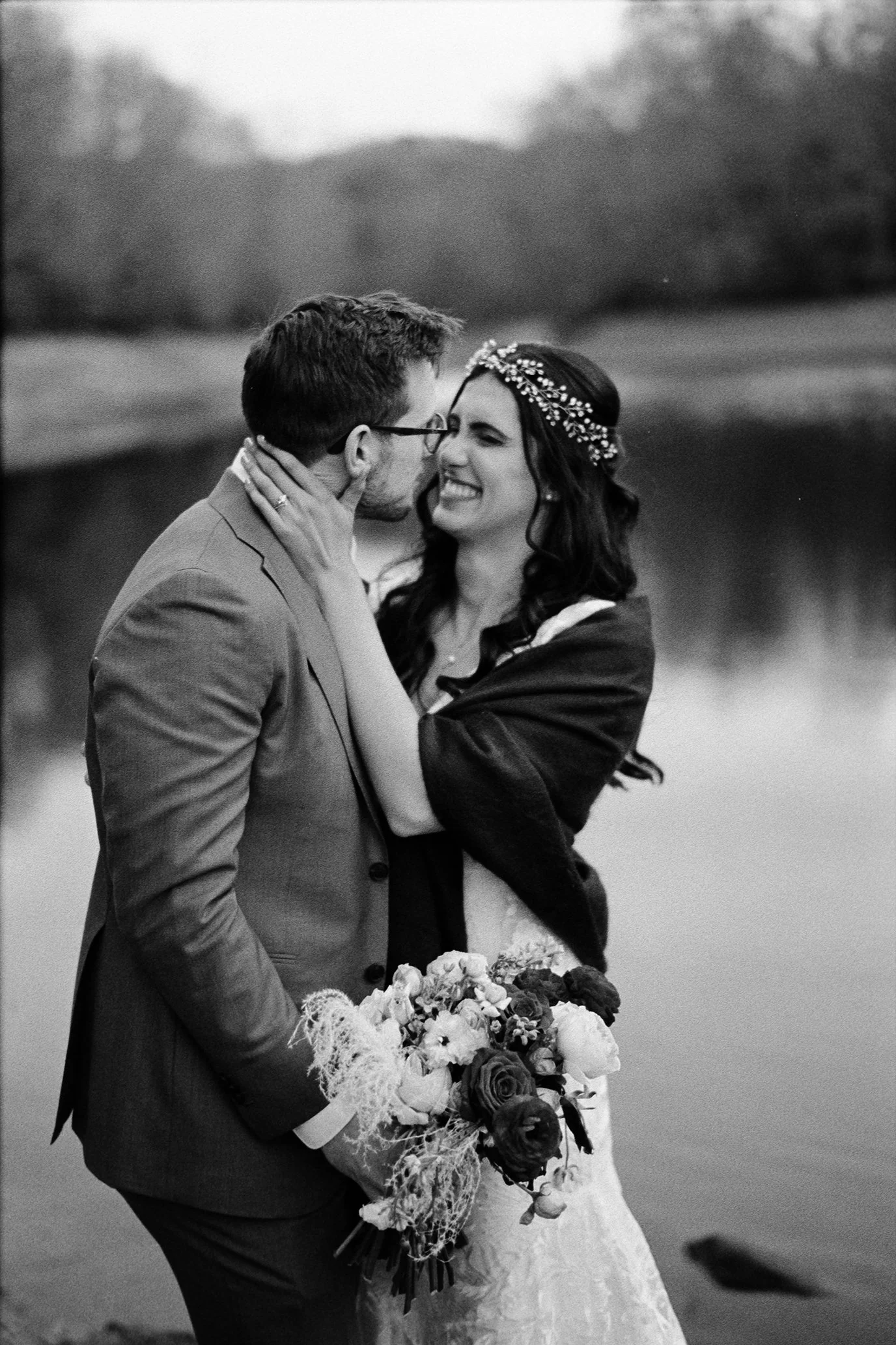 Black and white couple portrait beside a misty mountain lake at an Appalachian wedding