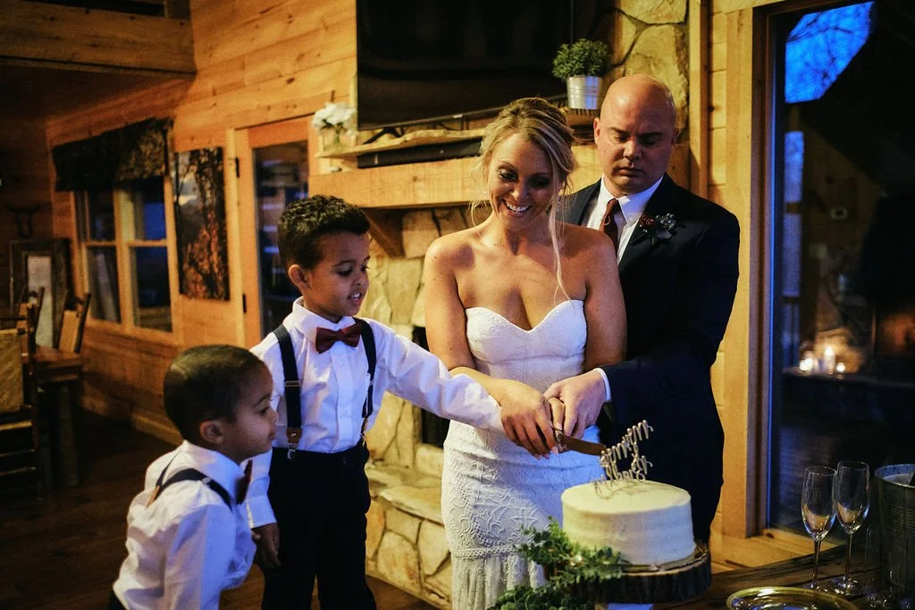 Candid moment of children at a dining table during an intimate mountain wedding reception, Blue Ridge GA intimate wedding photographer Appalachian Wedding Photography