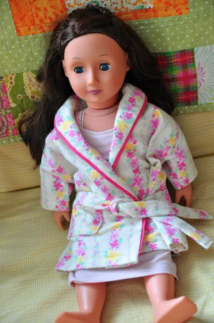 Victoria in her nightgown and robe.