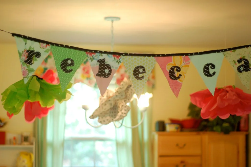 A banner I made when I threw my friend a baby shower several years ago. She hung it in the baby's nursery!