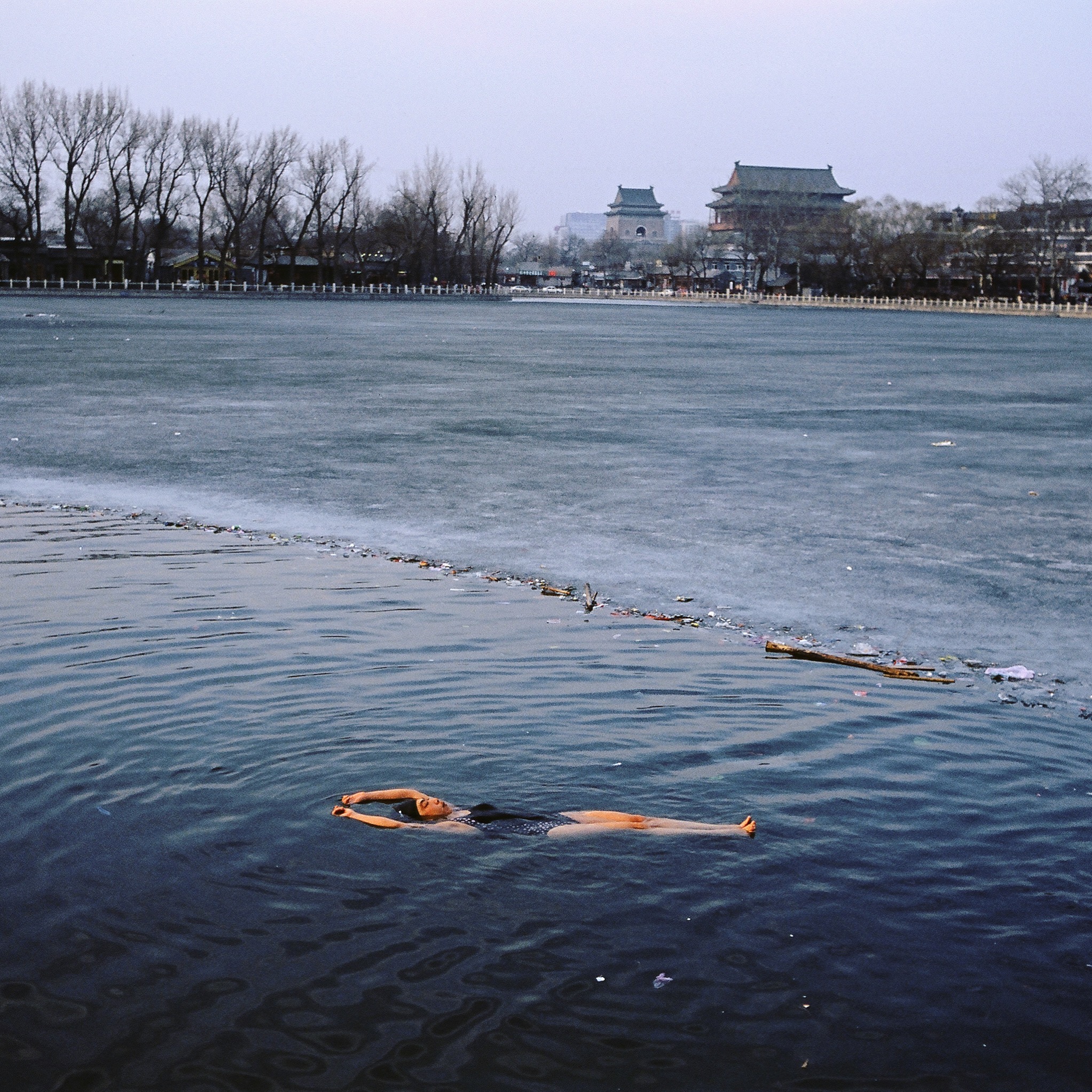 A winter swimmer relaxes in frozen Houhai Lake, Beijing.