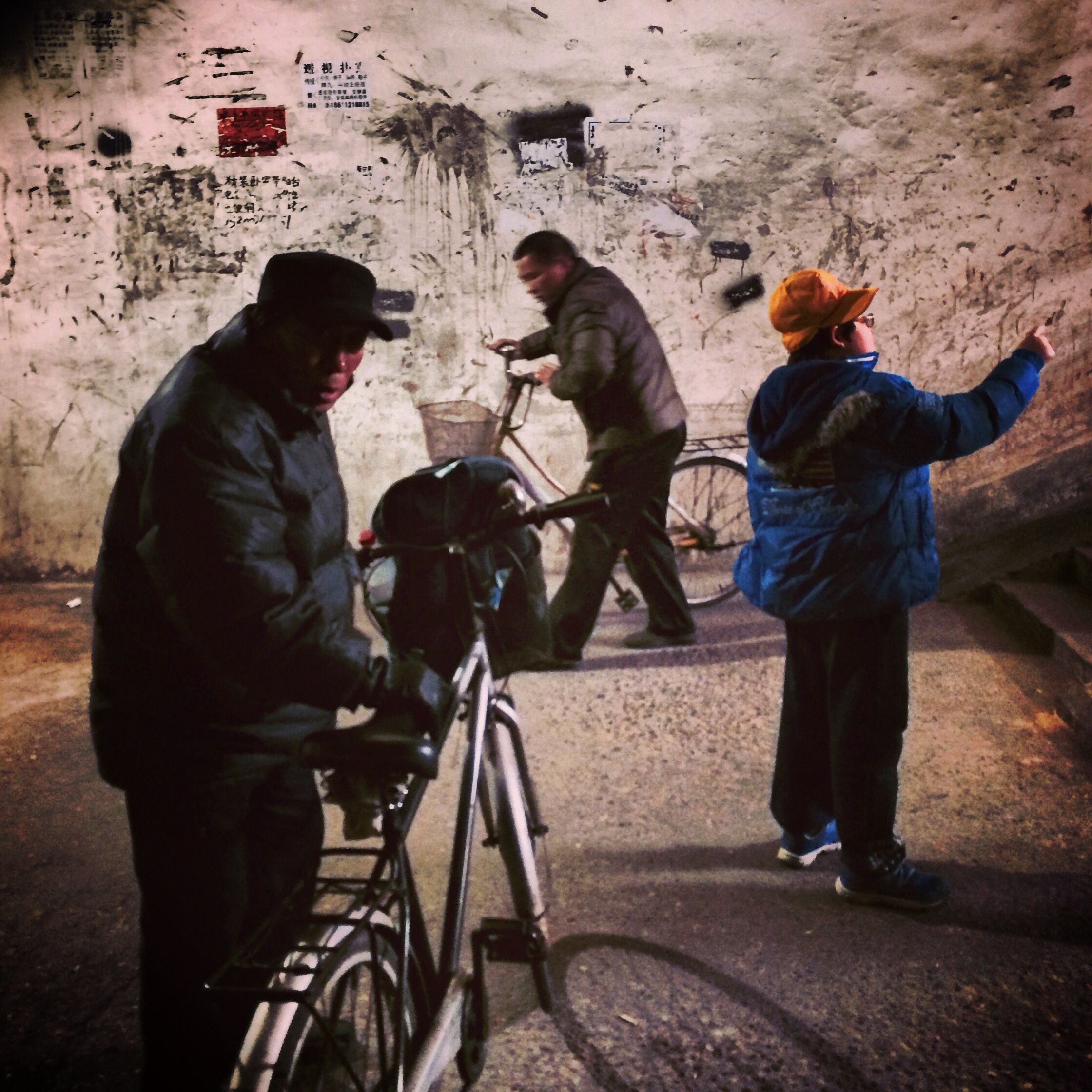 Bicycle commuters in an underground tunnel. Beijing.