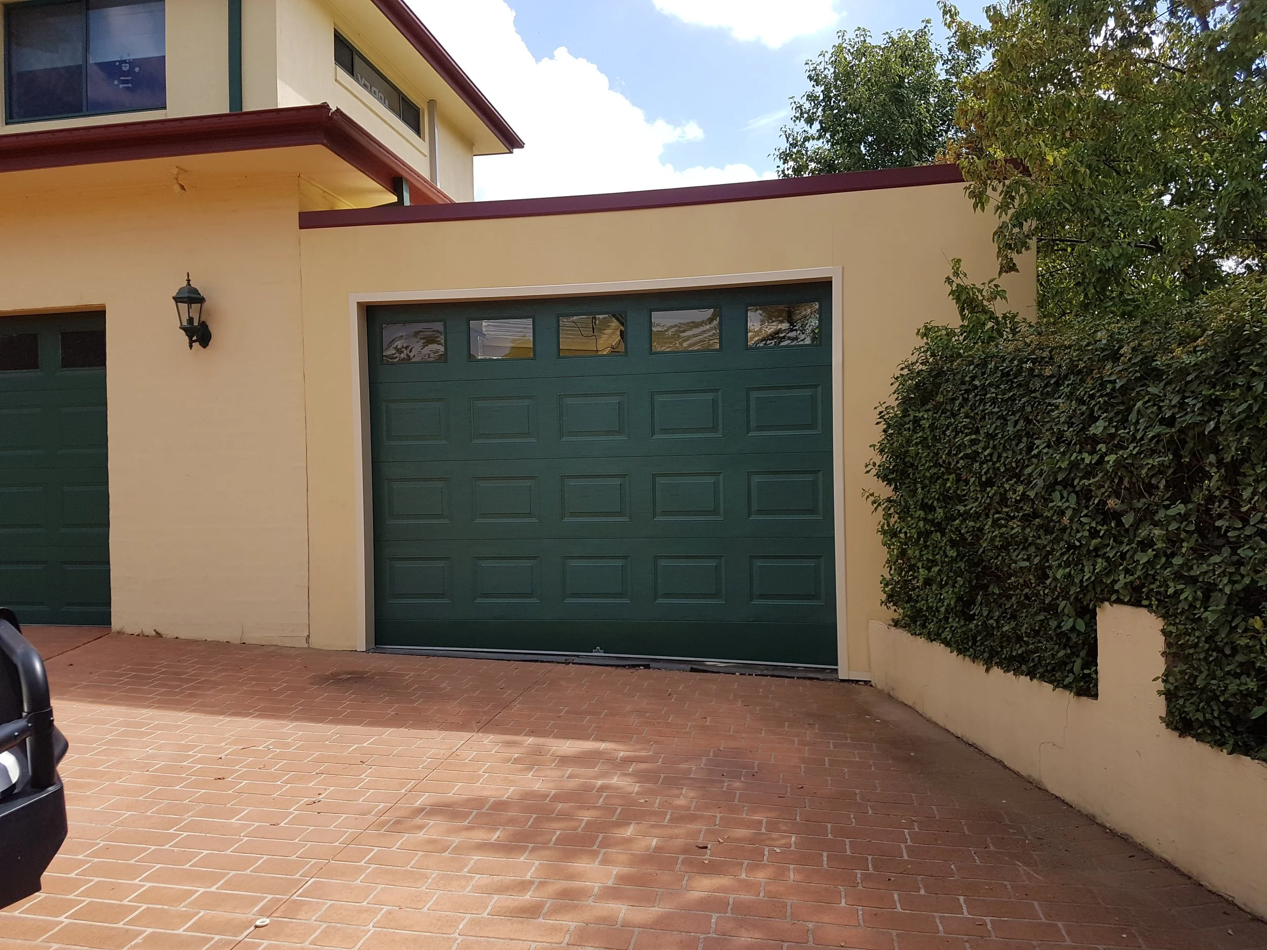 Rendered carport front with panel lift door.jpg