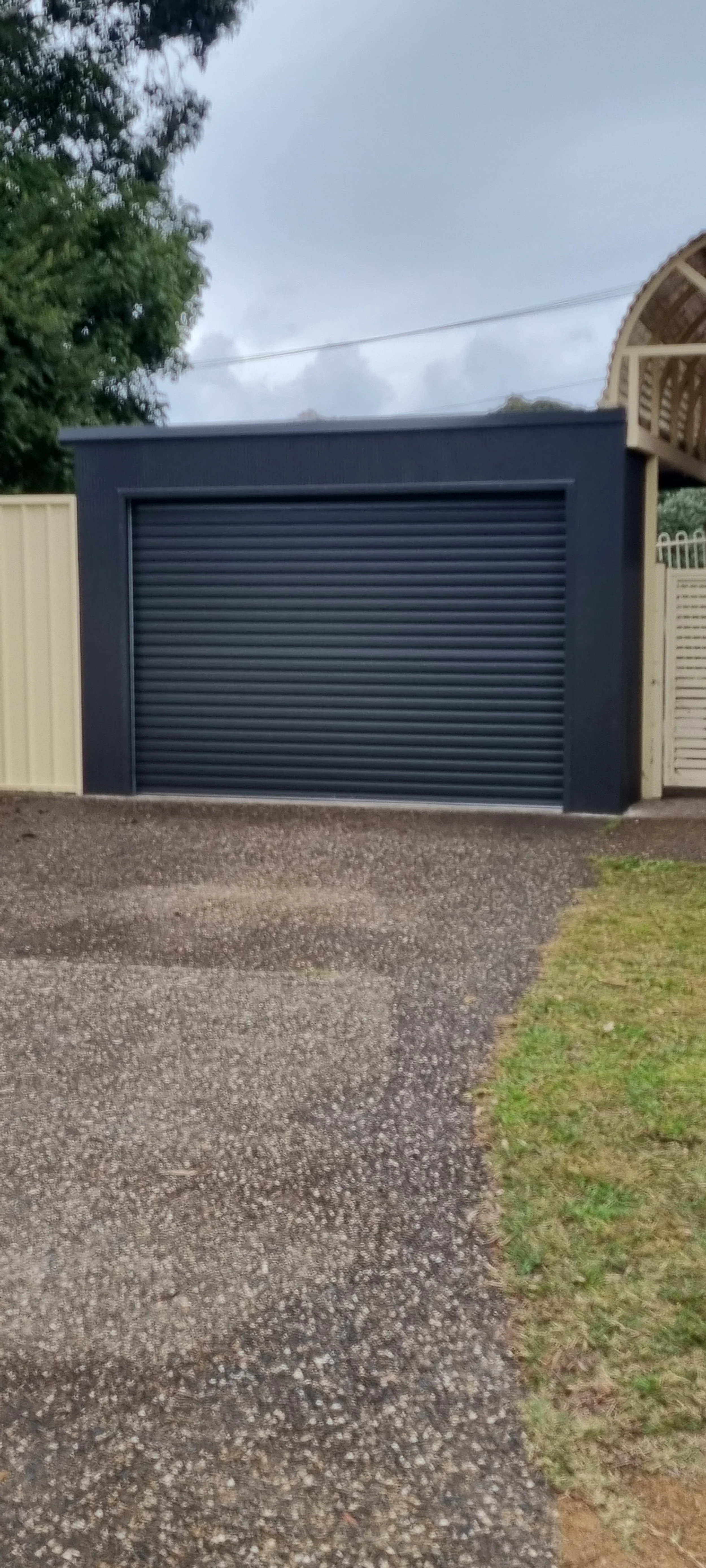 Carport with mini orb front and roller door.jpg