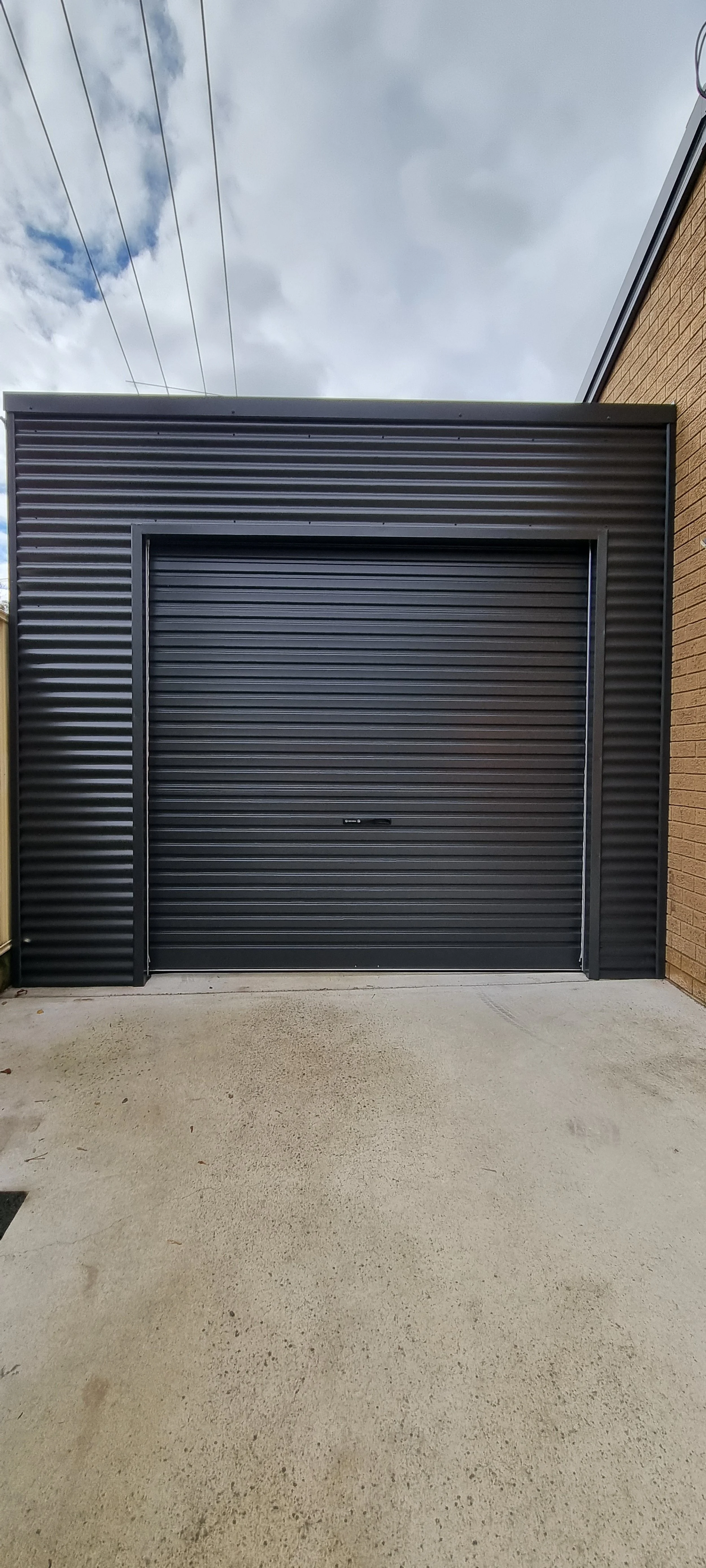 Colorbond Carport with automated roller door.jpg
