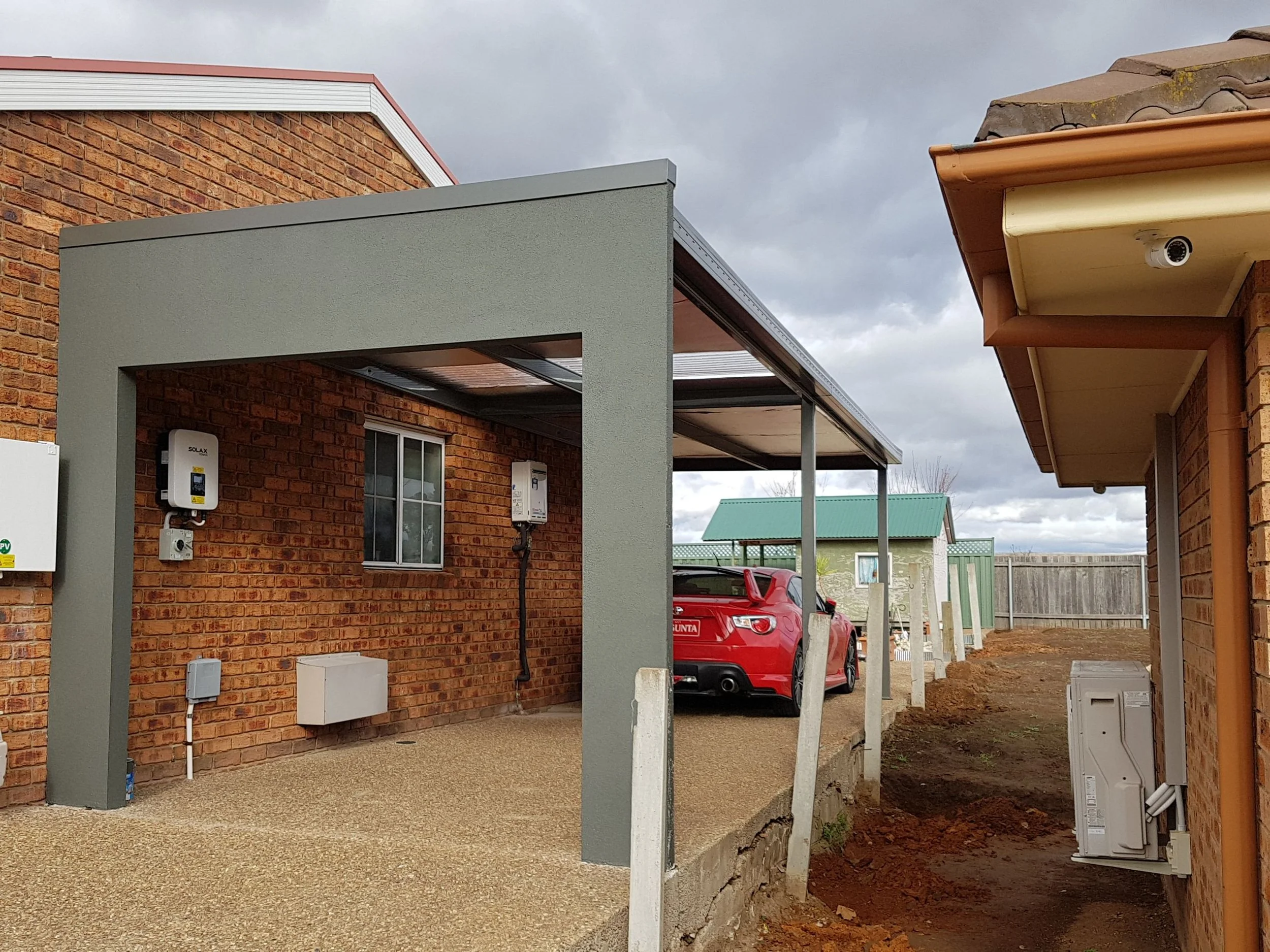 Carport with render front and roller door.jpg
