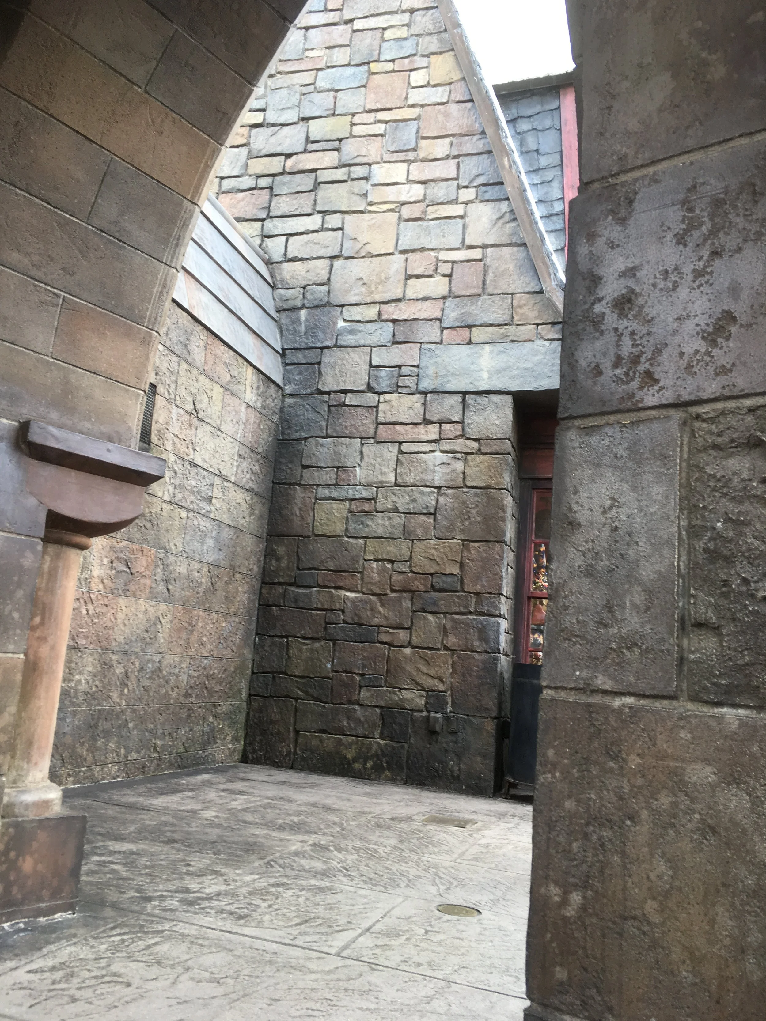  This is in Hogsmeade, the archway where we've begun a tradition of sitting underneath while I enjoy some pumpkin juice and stuff my face with a Cauldron Cake. 