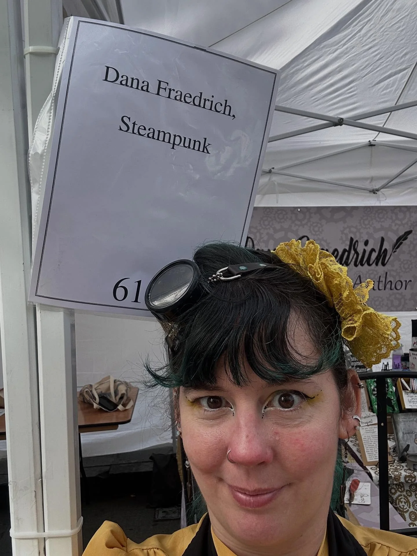 Because I vend under both my name and what I do&mdash;&ldquo;Steampunk Fantasy Author&rdquo;&mdash;that last part often gets truncated on signage. Then people trying to orient themselves somehow will ask me, &ldquo;Are you steampunk?&rdquo; as if I a