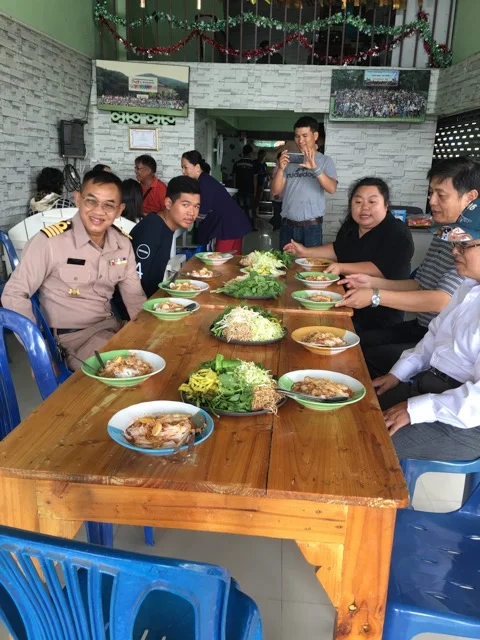 Clark and Shih-Kai sitting on the right across from Navy Captain Santi in Sattahip, Thailand
