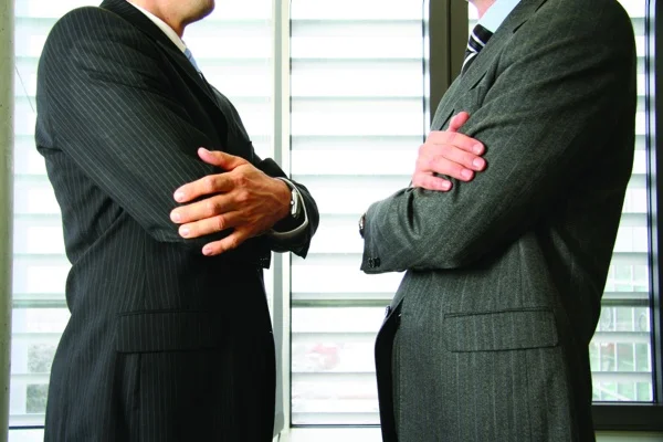istock businessman suits conflict disagreement facing(20).jpg