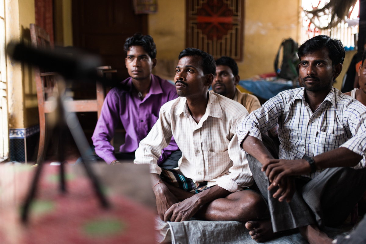  October, 2016. Patori Block, Samastipur district, Bihar, India.&nbsp;  A group of men watch an educational video on family planning for men's group meeting in the village. Pankaj, the Village Health Champion for ABT Associates meets men individually