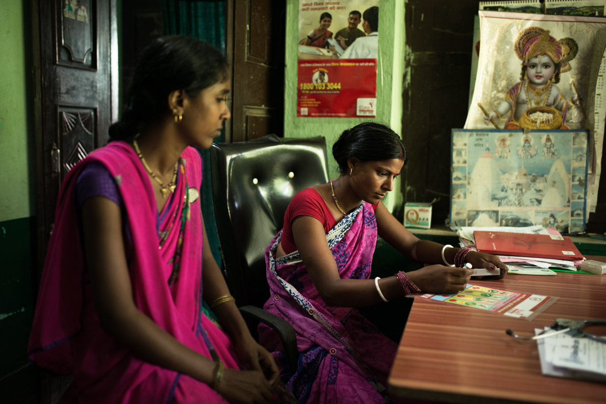 October, 2016. Vishnu Nursing Home, Samastipur district, Bihar, India. Premsheela Kumari (left) and Mamta Devi of Jalpur Village in Samastipur district consults the Resident Doctor of Vishnu Nursing Home on family planning options.