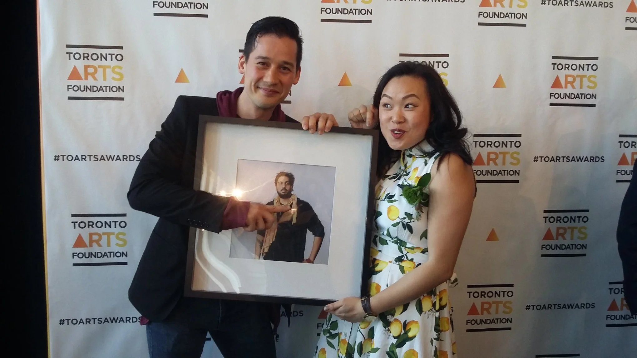 En Lai Mah, And Elizabeth Wong - Holding a Jiv (Jiv featured appears smaller than an actual Jiv). 