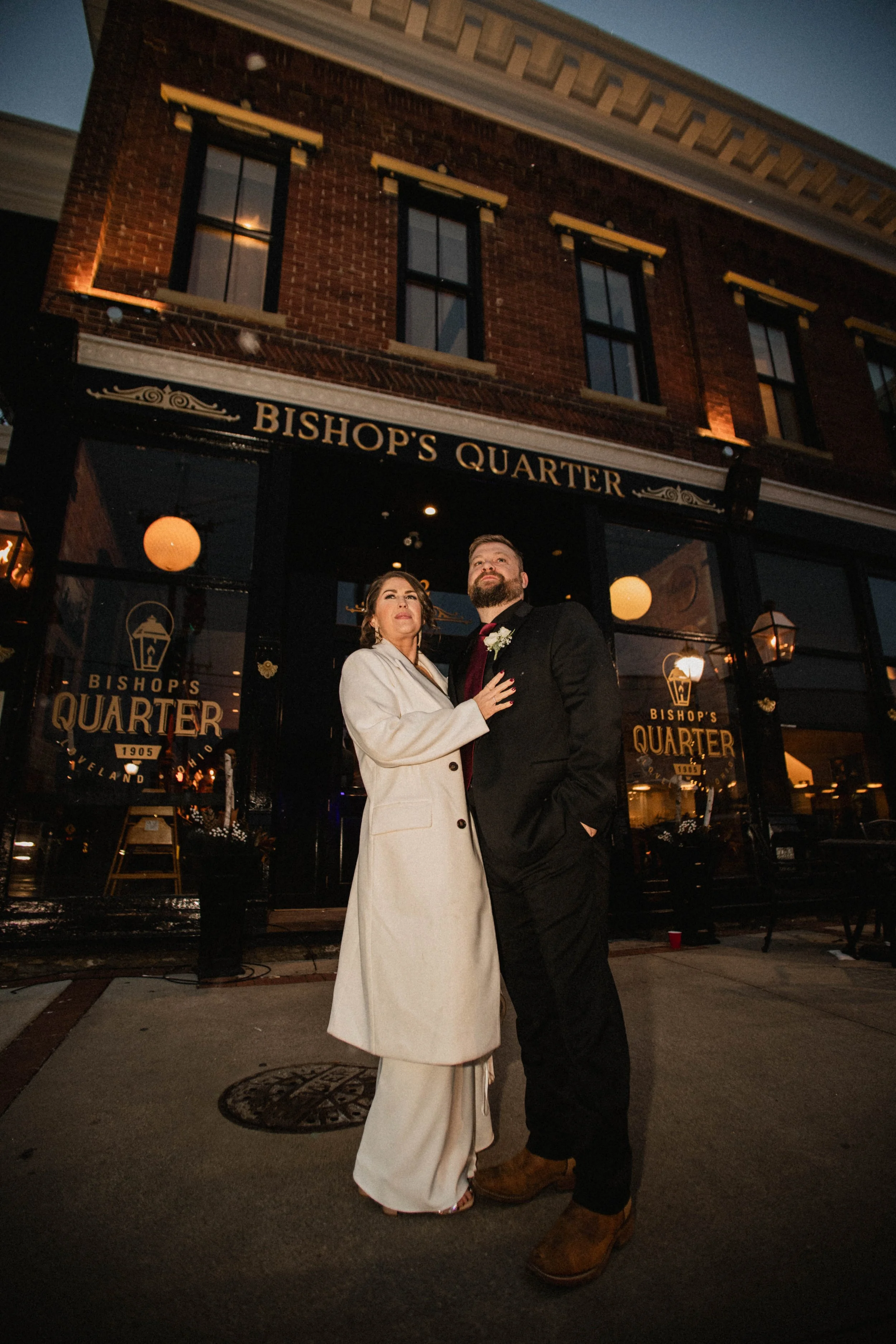 Bride and groom Tony and Kelsey posing outside Bishop’s Quarter in Loveland, Ohio on their wedding day