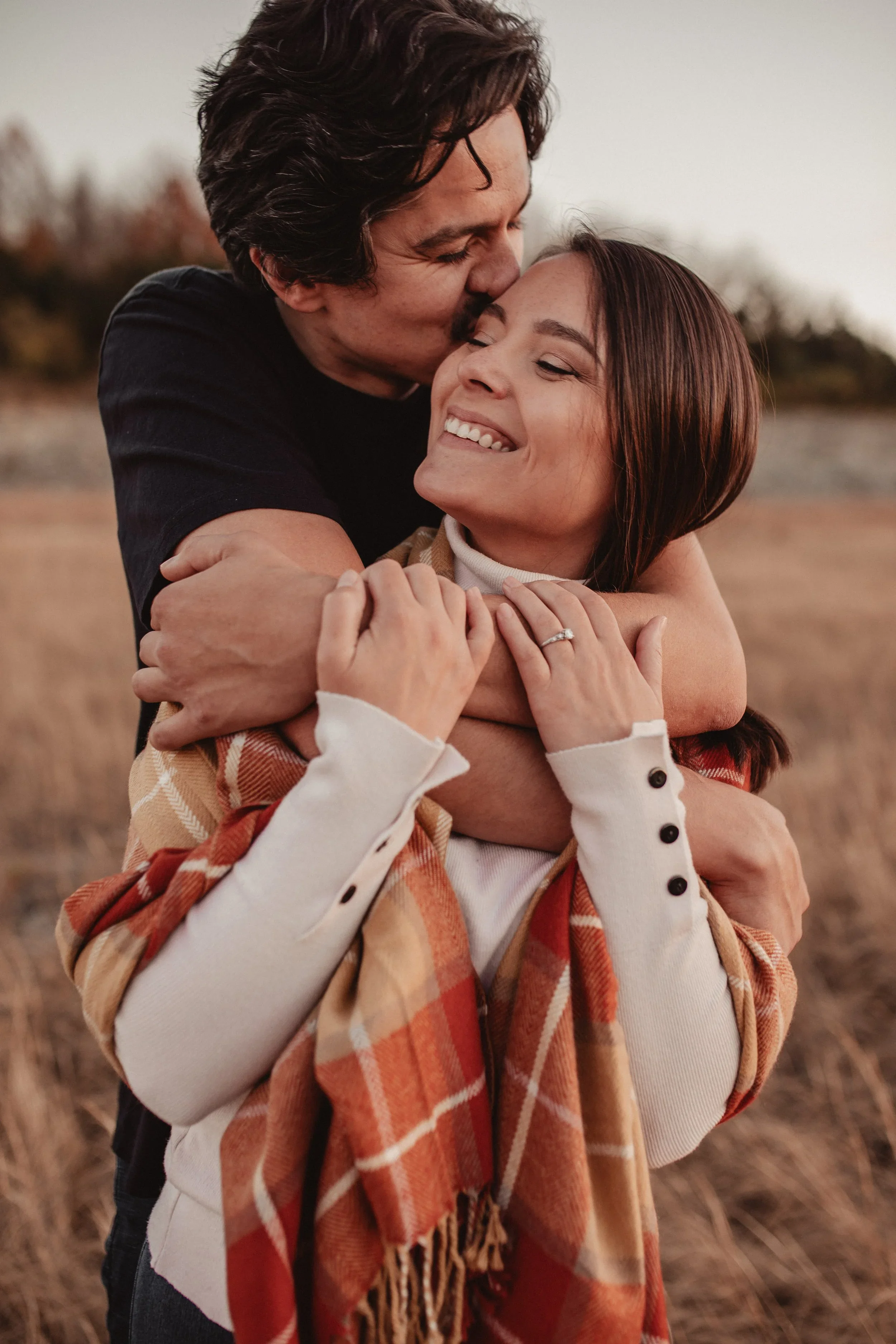 Romantic engagement photo of a couple embracing outdoors in Cincinnati, Ohio, photographed by Sarah and Jordan Epperson of Every Atom Photography, a Cincinnati wedding and engagement photography team.
