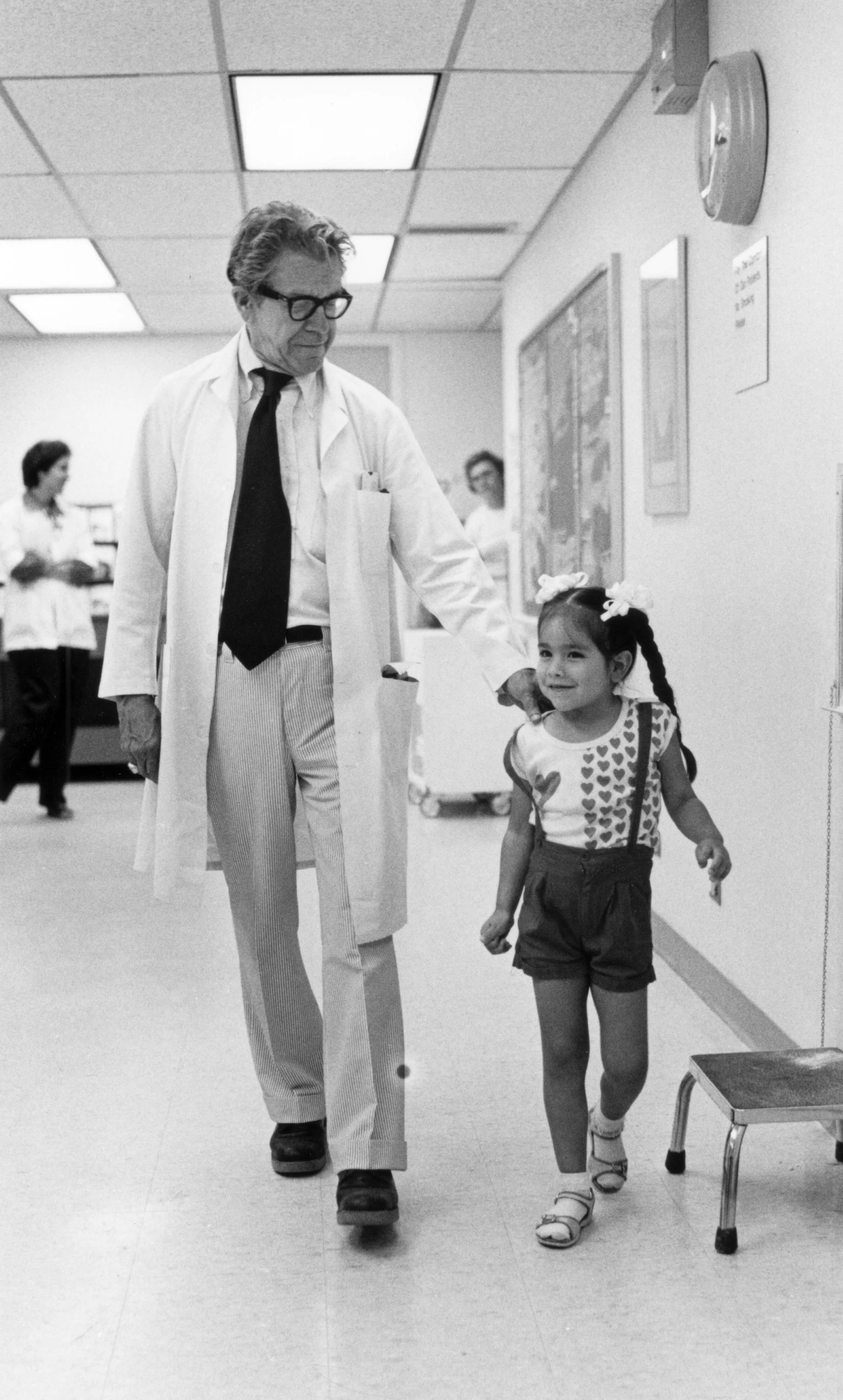 Pioneering pulmonologist Dr. Gunyon M. Harrison works with a patient in the Junior League Clinic at Texas Children’s Hospital. 