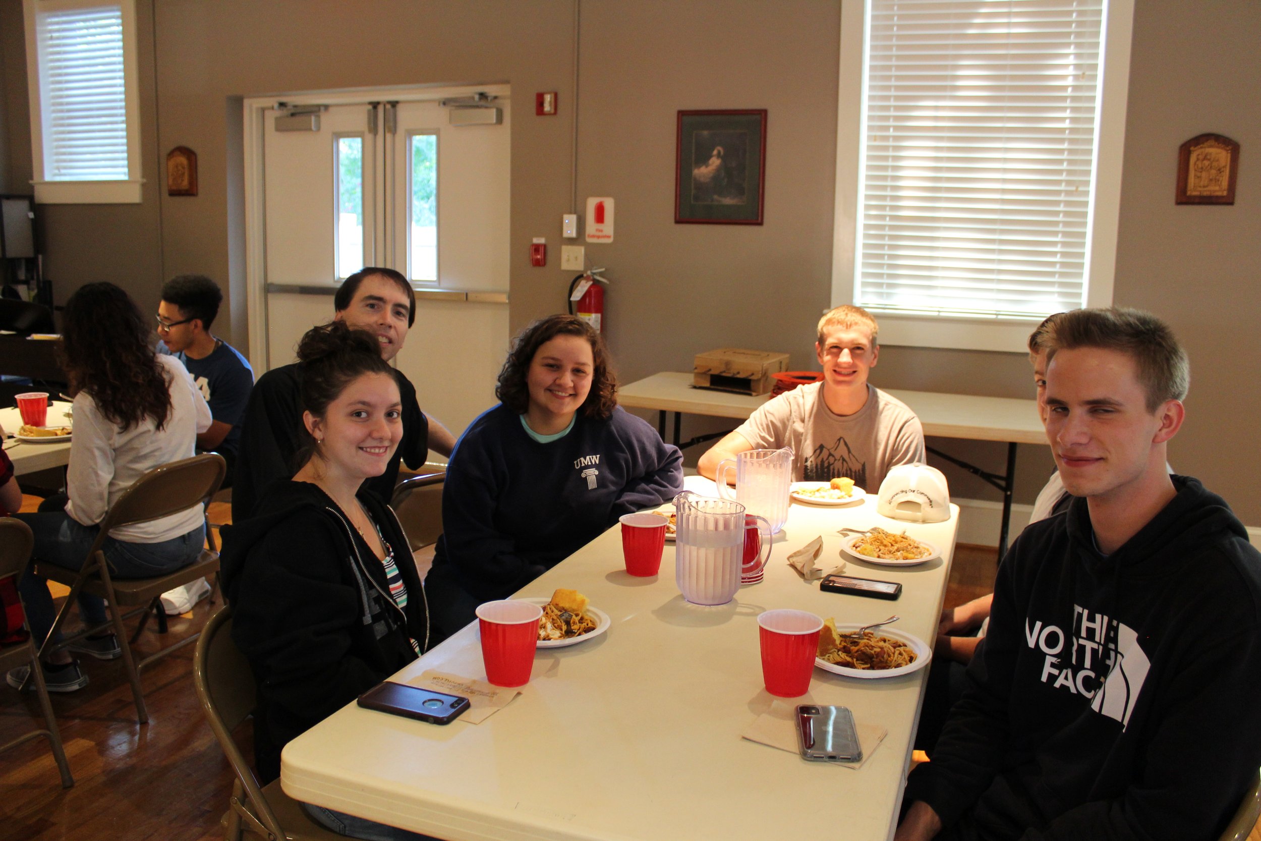  Students and Father Vaccaro during one of our social gatherings. 