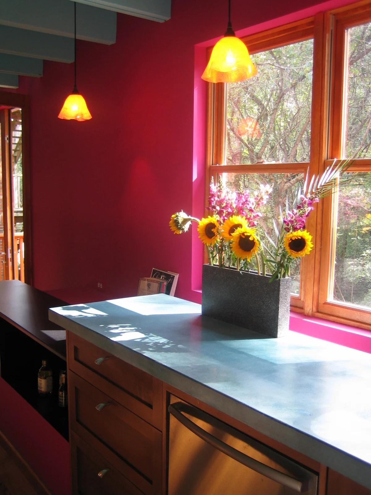  The blue concrete counter and base cabinets were set 6” higher than standard in Stephen’s personal home, but in such a way that they could easily be dropped to standard height when it came time to sell. 