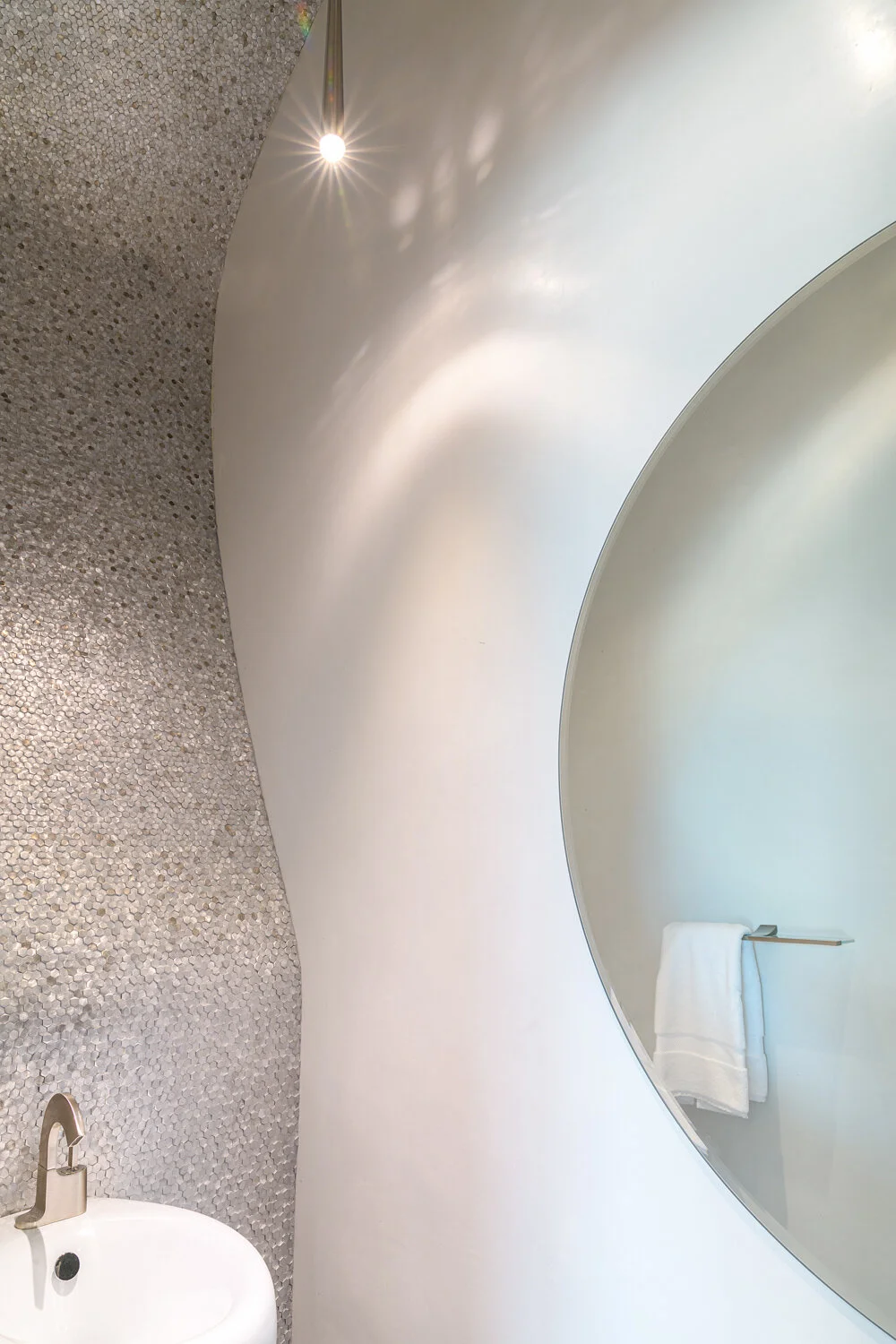  Powder Room from ‘Alice in Wonderland’ - the tiled wall undulates up and over and back down the other side. To get the wall-hung sink and wall-hung toilet on the opposite side to match as closely as possible, we bought a bidet and hung it at sink he