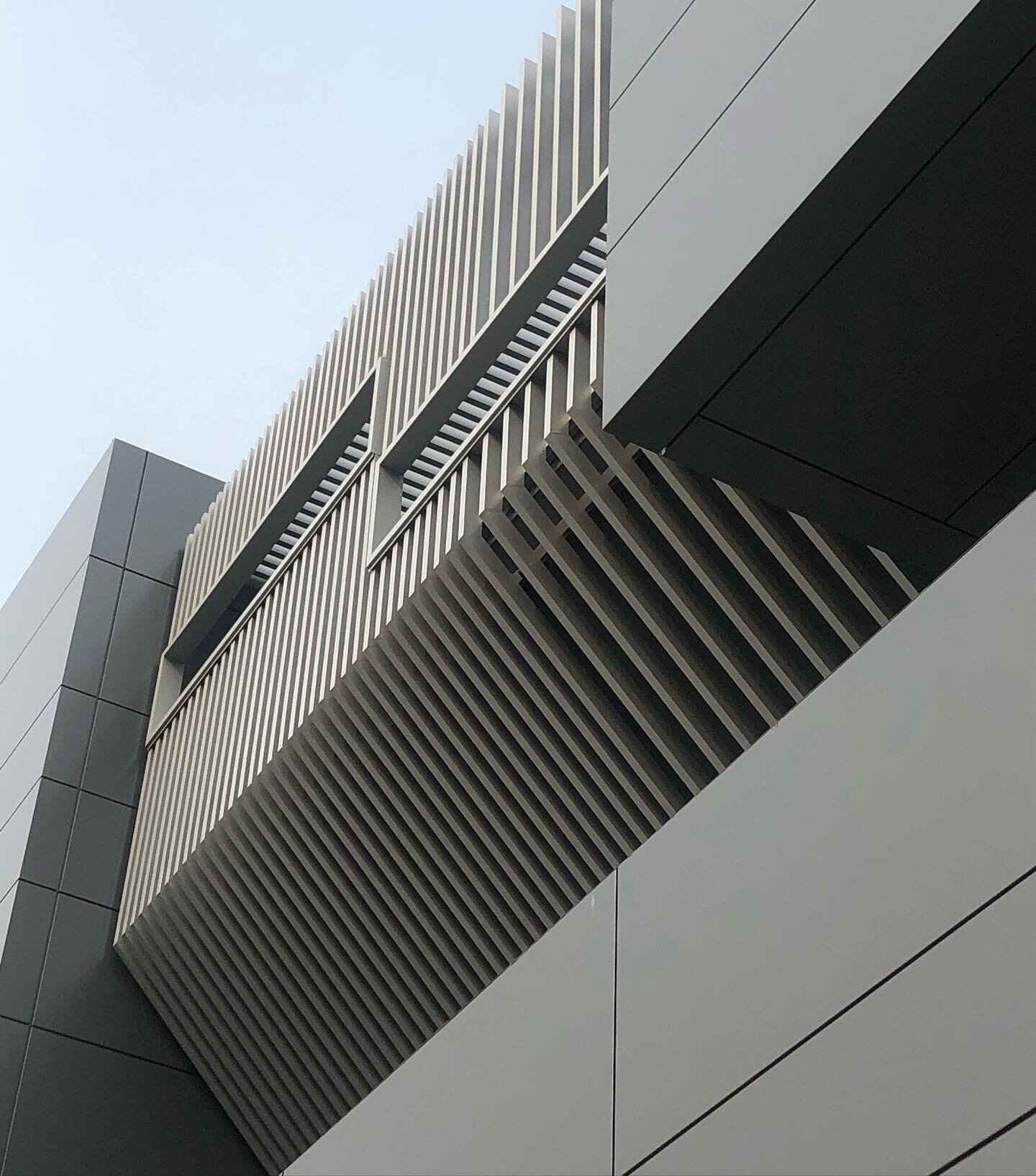 Fabricated and installed Aluminum tube facade on this commercial building in Torrance, CA.  We installed horizontal mounting rails and individually mounted every vertical tube.  All angle transitions were welded and ground smooth and finished with an