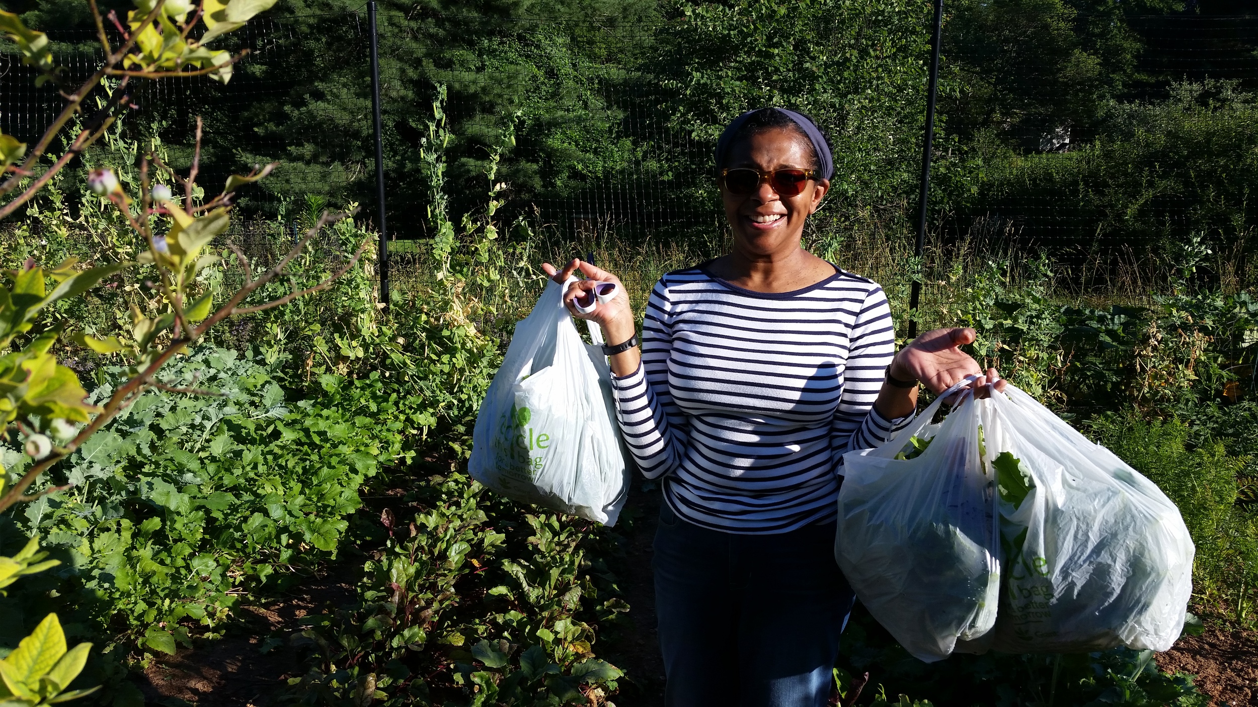 Friend Beverly Moulton with her morning's pick of produce from the garden.