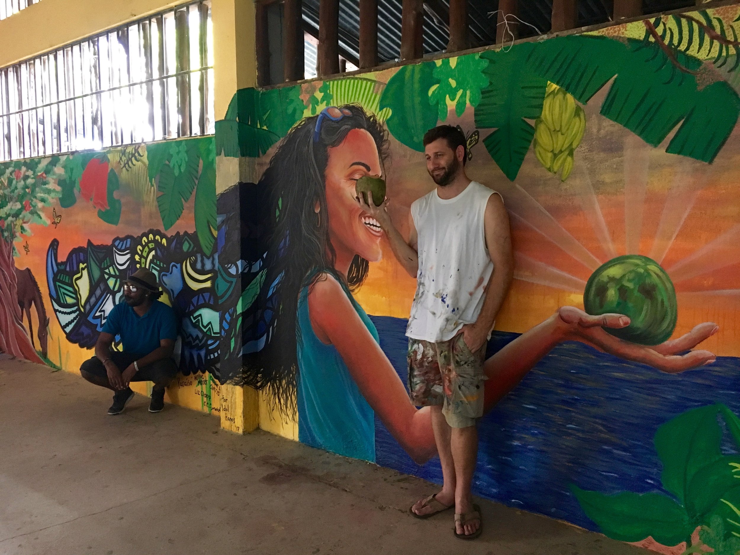 Alloyius McIlwaine (left) and Curtis Glover (right) posing in front of the finished mural