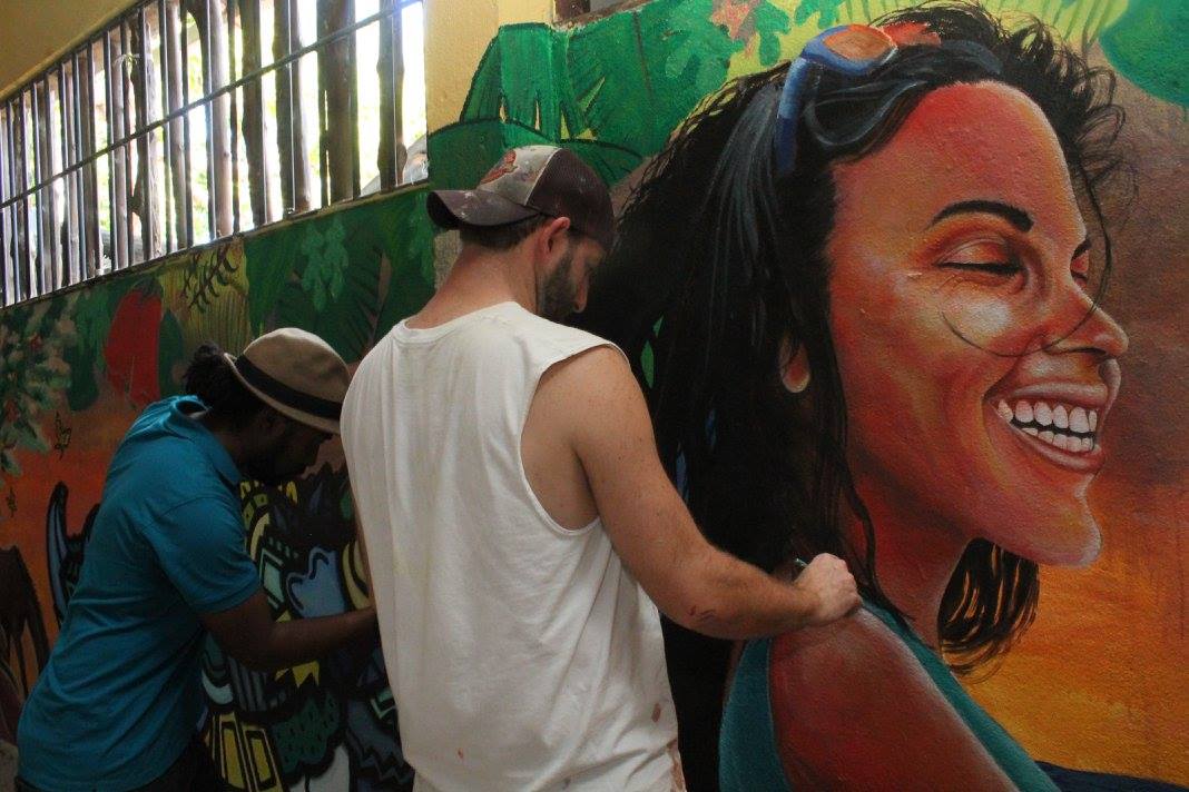 Artists Alloyius McIlwaine (left) and Curtis Glover (right) at work