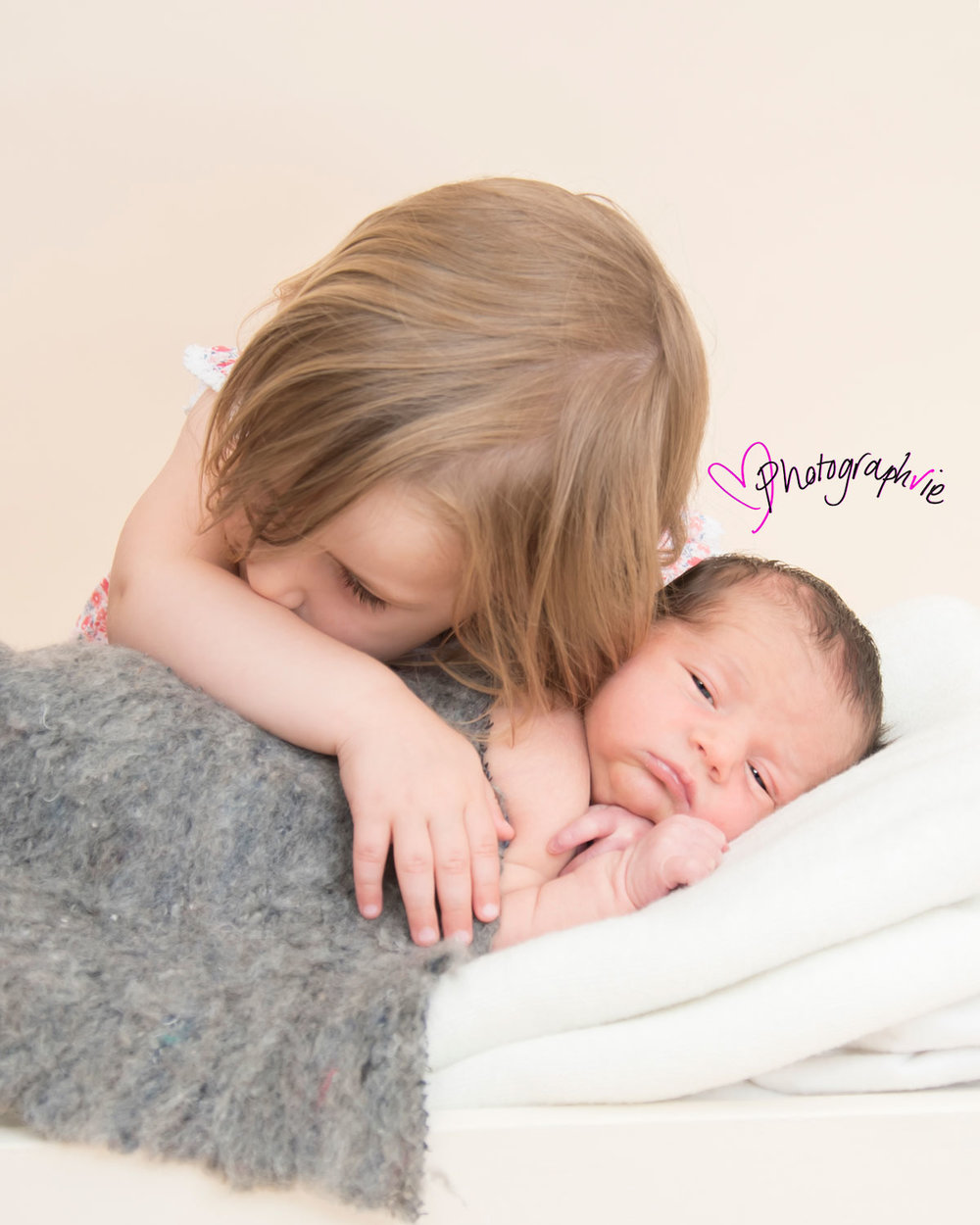 Newborn_Baby_photography_Ely_Cambridgeshire-baby-finley-cuddles-with-big-sister.jpg