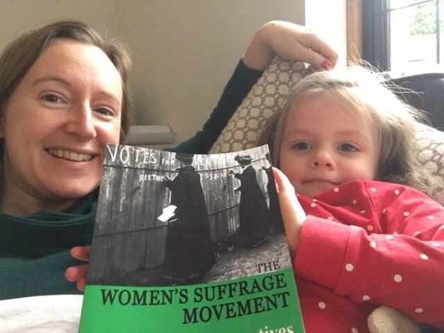 4 year old Jemima questioning pictures of women in big hats and sashes writing on walls to demand the vote