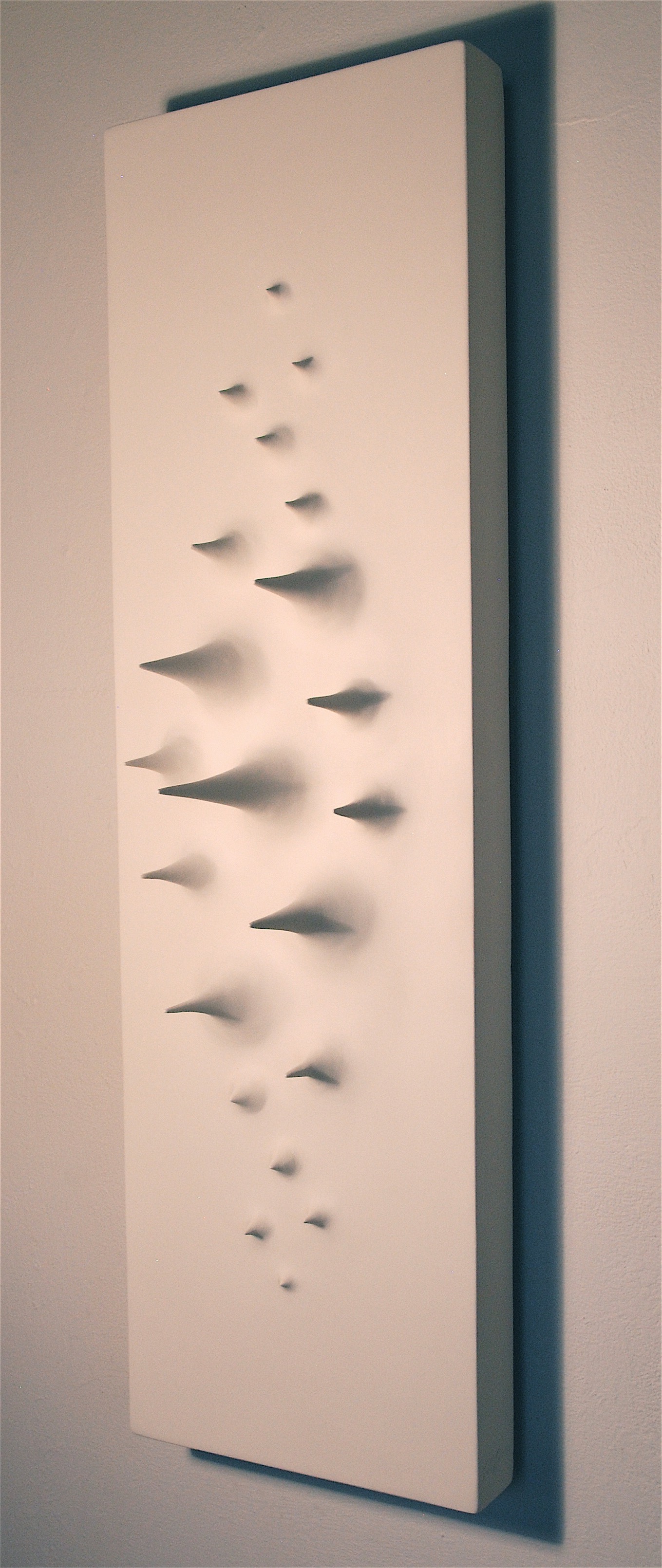 Thomas Coffin - Spikes (white), 40"h x 12"w x 10"d, mixed media sculptural wall relief