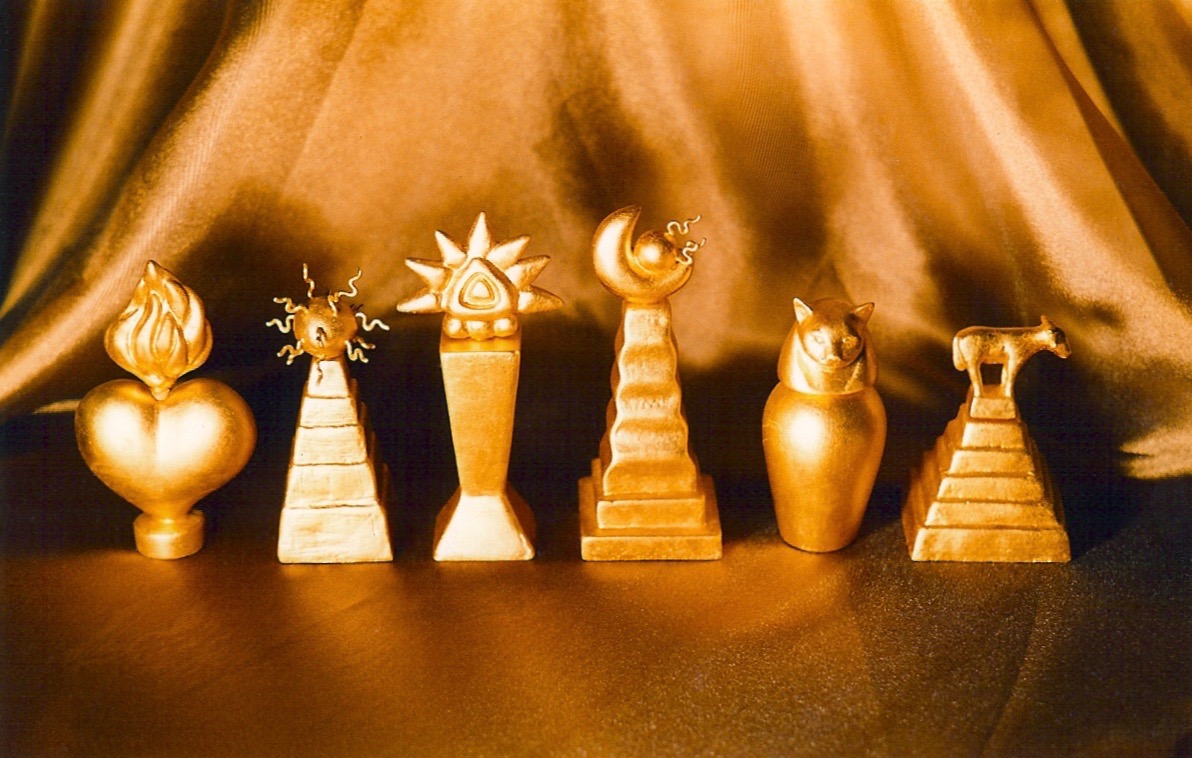 Coffin & King - Gilded Perfume Bottles - Heart, Sun God, Golden Idol, Half Moon, Cat, Golden Calf, cast stone, glass lined, 23 kt. gold leaf, 1990s 