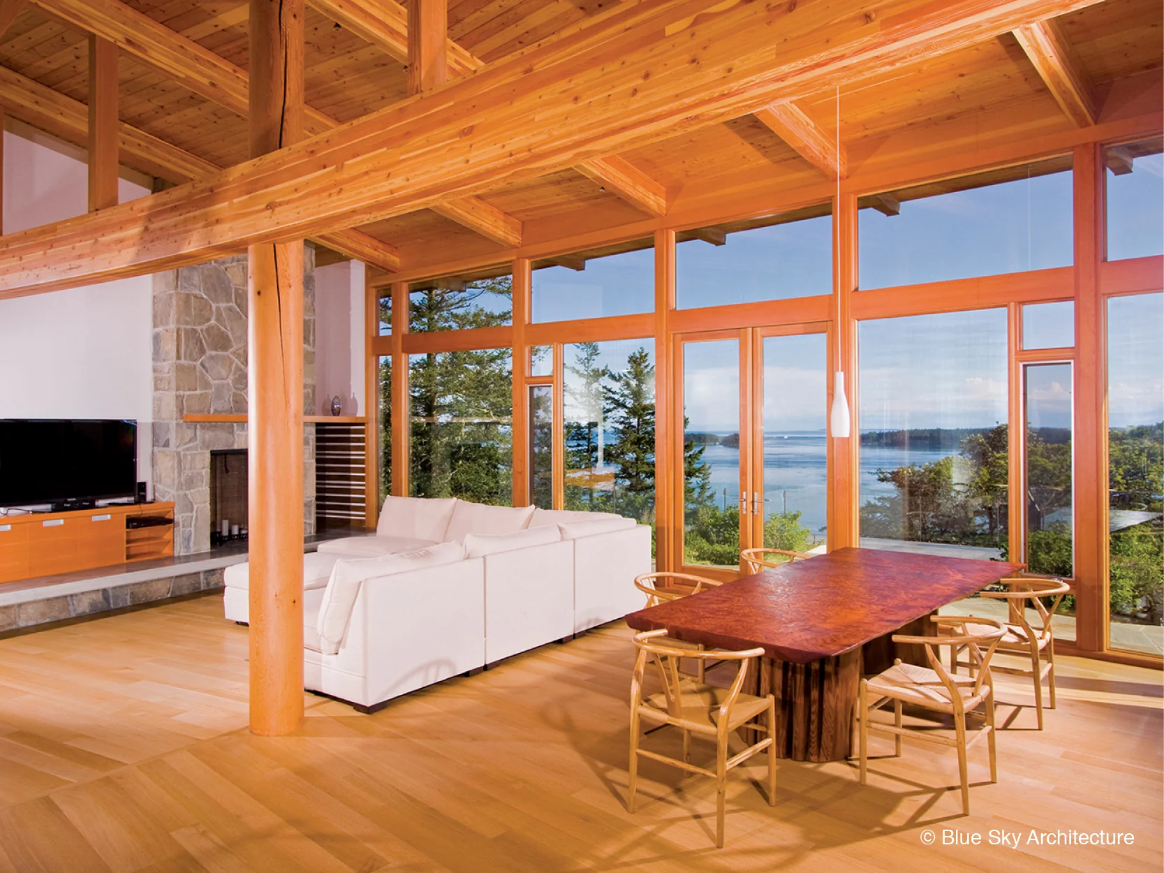 Open-floor-plan dining and living room with ocean views