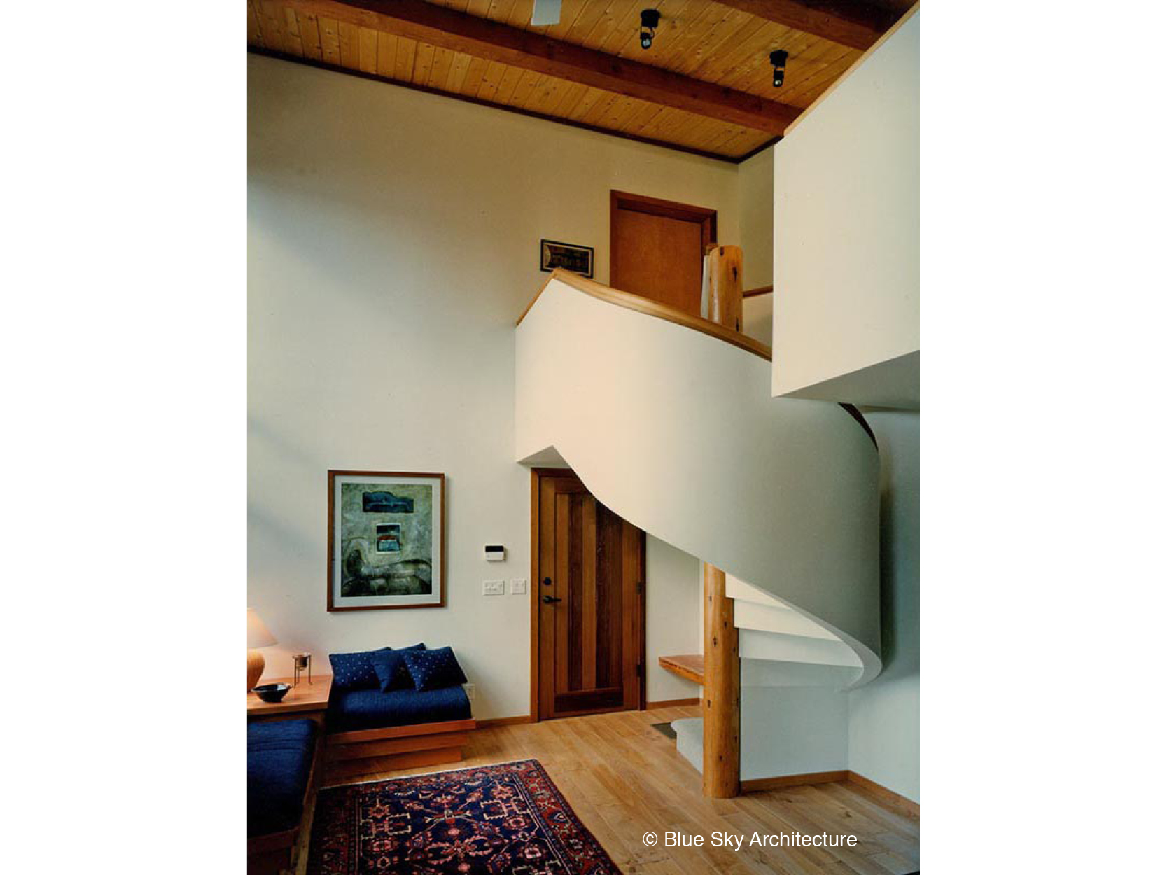 Living Room with Post and Beam and Spiral Staircase